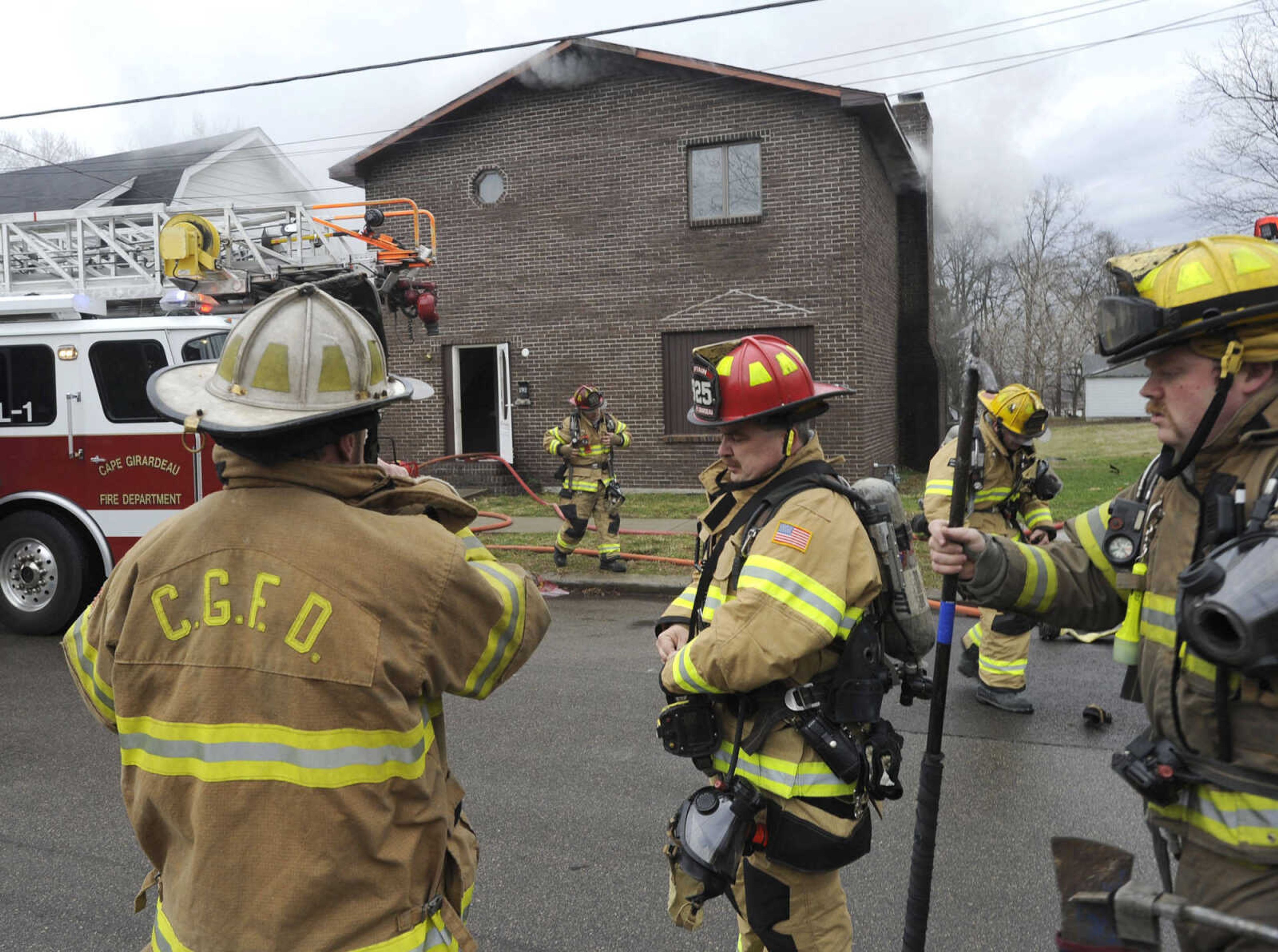 Cape Girardeau fire chief Rick Ennis directs firefighters at a fire at 916 N. Fountain St. on Monday afternoon, Feb. 4, 2013. (Fred Lynch)