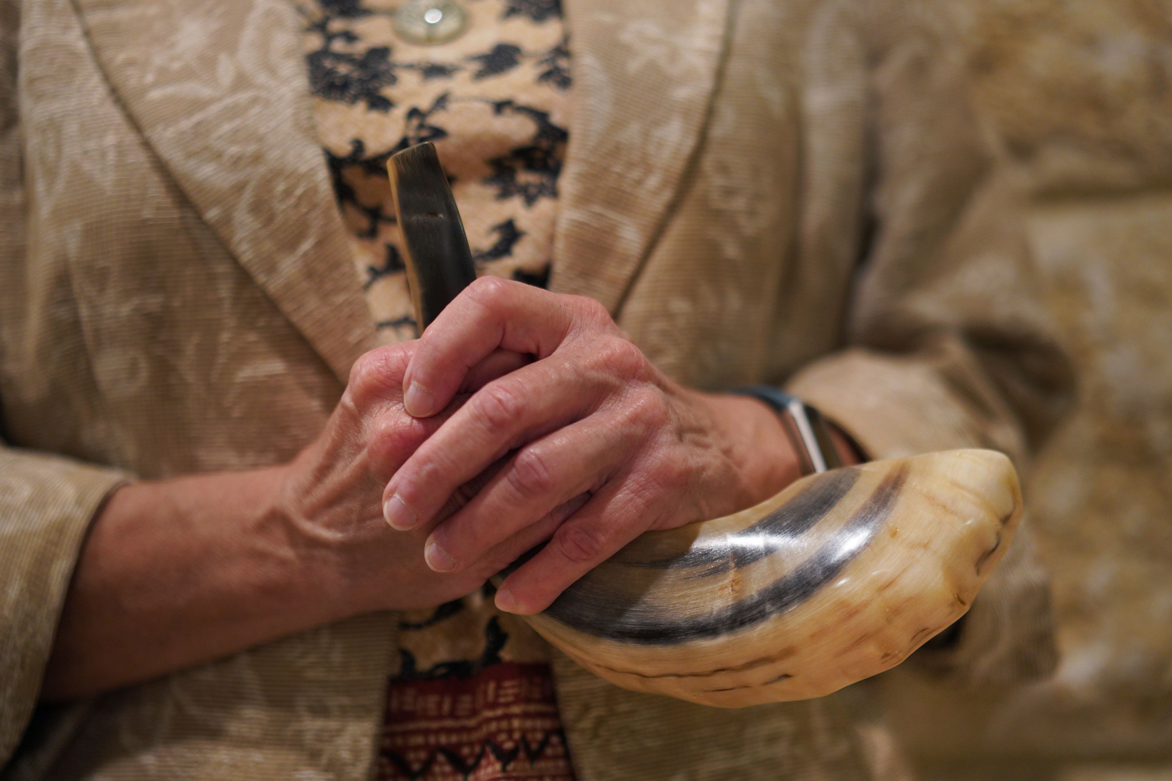 Audrey Glickman holds a shofar, a musical horn used in Jewish religious ceremonies, Friday, Sept. 27, 2024, in Pittsburgh. (AP Photo/Jessie Wardarski)