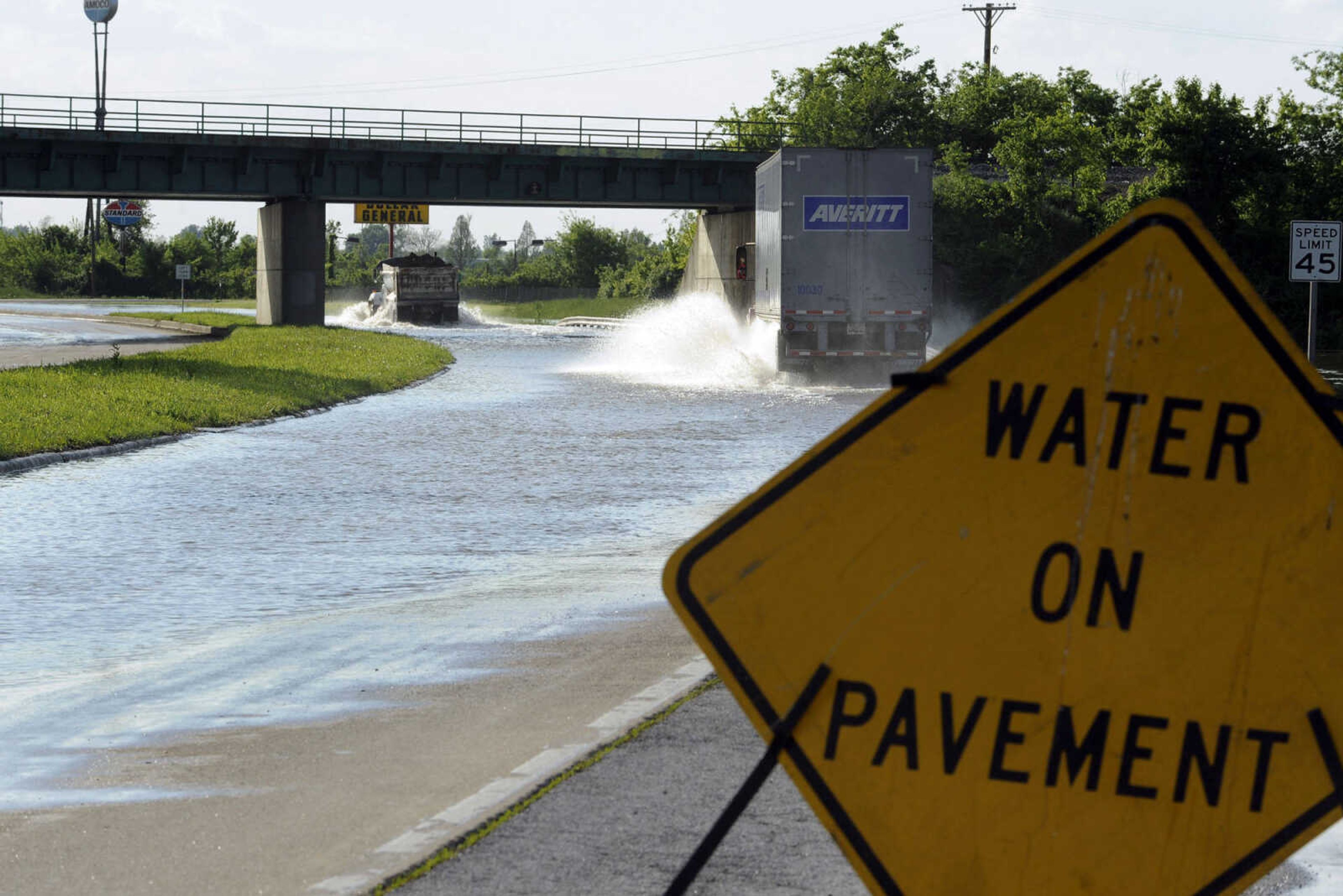 FRED LYNCH ~ flynch@semissourian.com
Only large vehicles were permitted to drive through floodwaters covering the northbound lane of Illinois Highway 3 just north of Cairo, Ill. late Tuesday afternoon, May 3, 2011. With Cairo closed, other traffic was diverted north on Highway 37 toward Mounds.