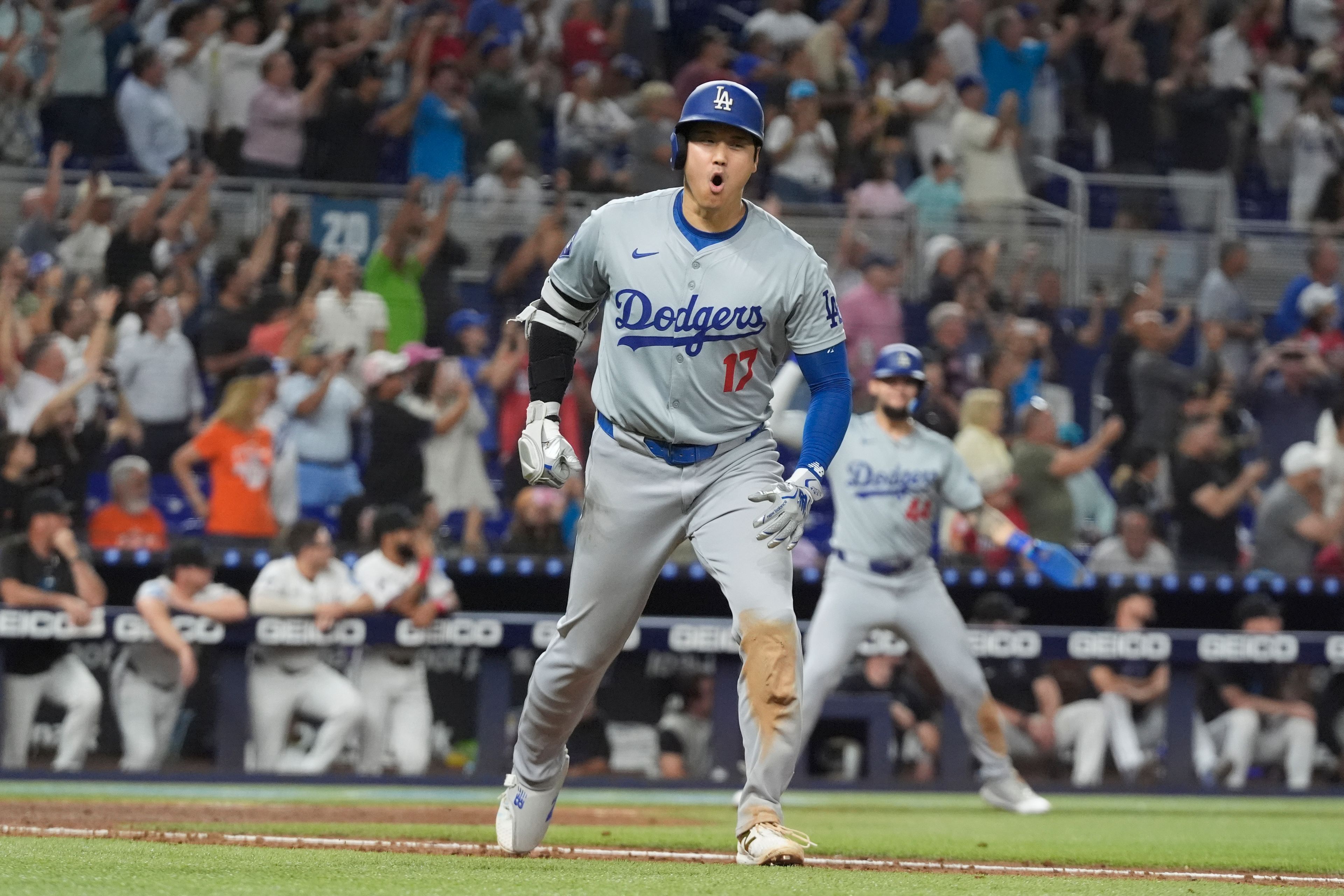 Los Angeles Dodgers' Shohei Ohtani (17) reacts after hitting his 50th home run of the season during the seventh inning of a baseball game against the Miami Marlins, Thursday, Sept. 19, 2024, in Miami. (AP Photo/Marta Lavandier)