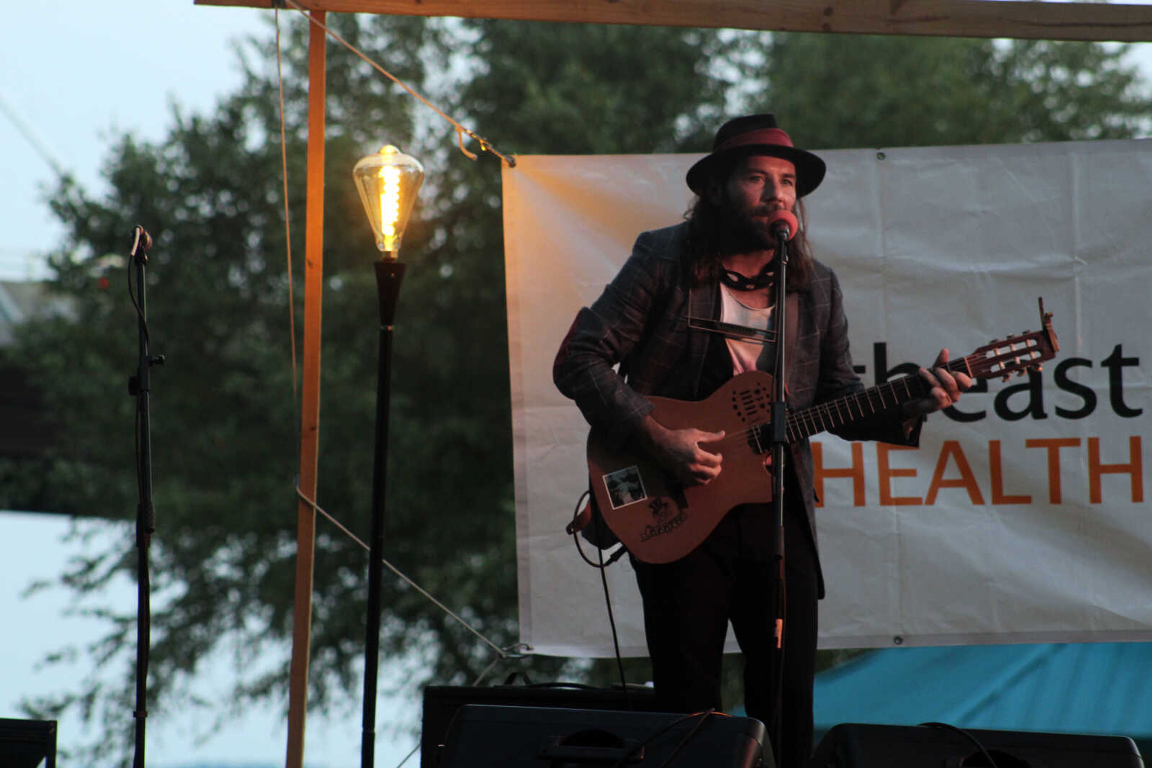 Carl Banks, a blues, roots and folk rock musician from New York, New York, performs during Tunes at Twilight Friday, Sept. 3, 2021, at River Campus Park, located at the intersection of South Spanish and Morgan Oak streets.&nbsp;