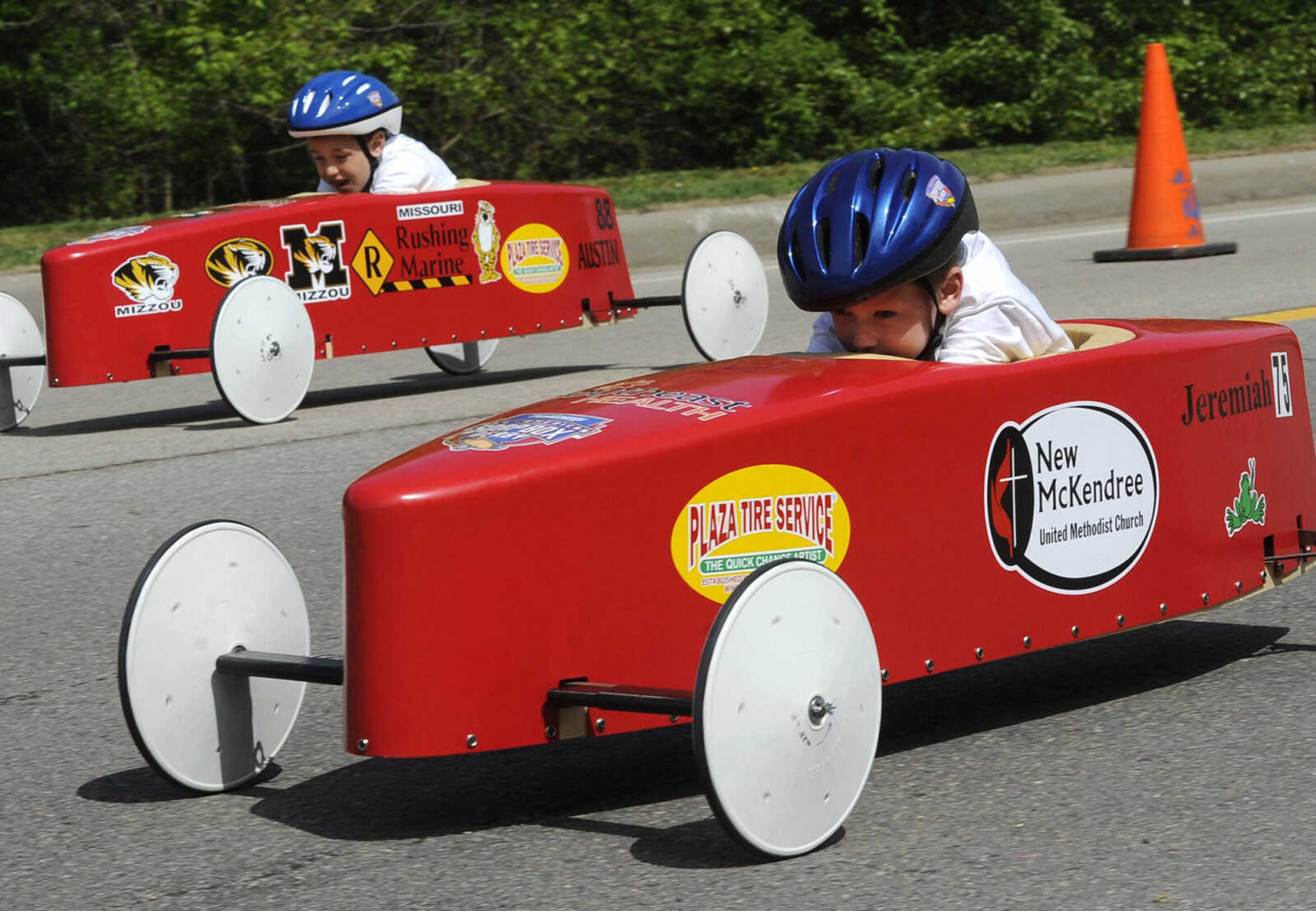 Jeremiah Kunz, front, races Austin Rushing during the Soap Box Derby sponsored by the Cape Girardeau Rotary Club on Saturday, May 3, 2014 in Cape Girardeau.