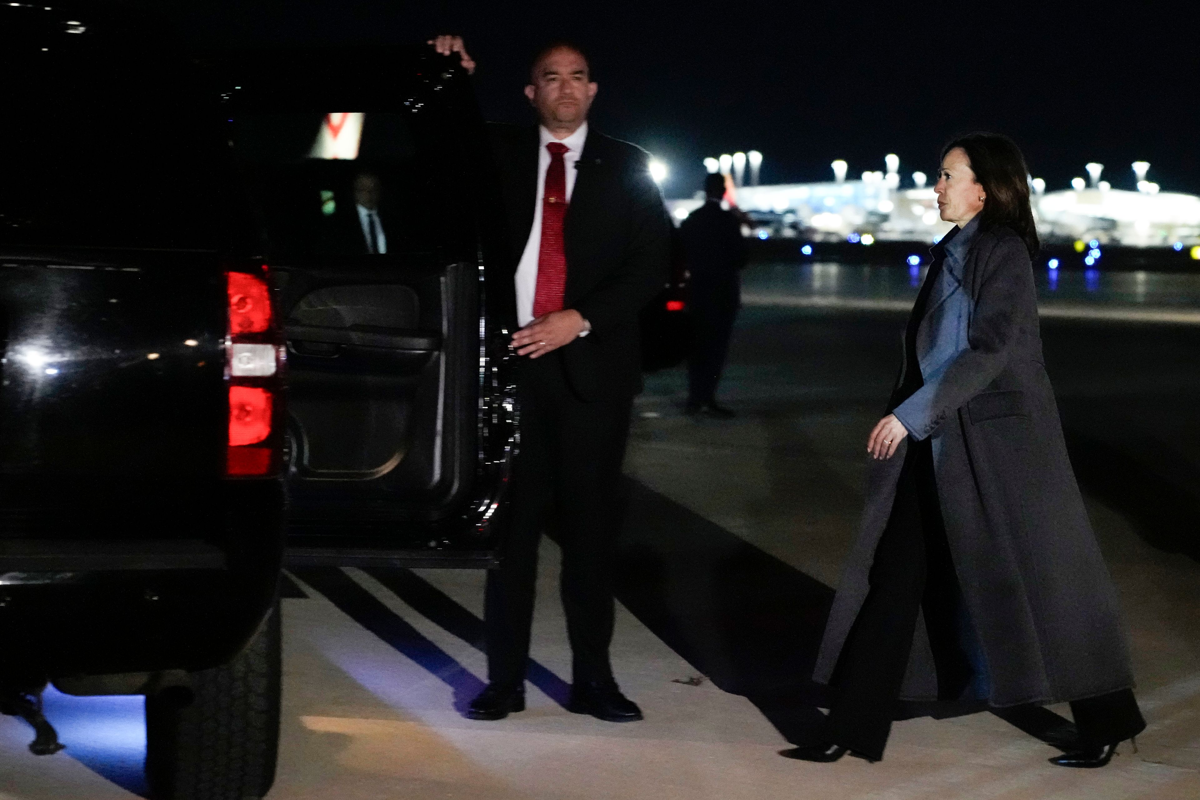 Democratic presidential nominee Vice President Kamala Harris arrives at LaGuardia Airport, Saturday night, Nov. 2, 2024, in East Elmhurst, N.Y. Harris has made an unannounced trip to New York to appear on an episode of “Saturday Night Live,” briefly stepping away from the battleground states she’s been campaigning in with just three days to go before the election. (AP Photo/Jacquelyn Martin)