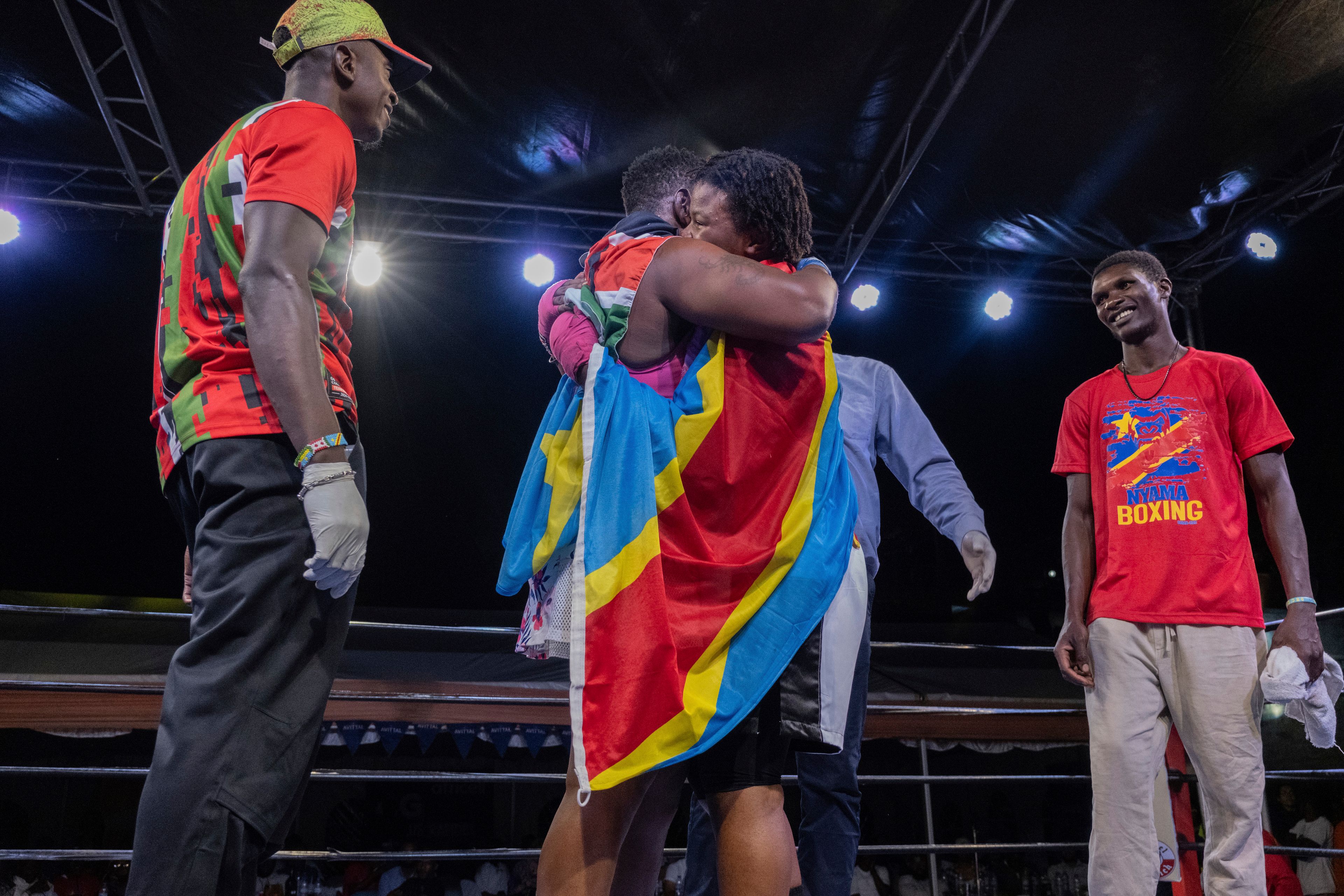 Daniella Mulekets, 20, celebrates after winning in her first professional boxing match against Kenyan Charity Mukami in Goma, Democratic republic of the Congo, Oct. 26 2024 on the 50th anniversary of the "Rumble in the Jungle" fight between Muhammad Ali and George Foreman in Kinshasa. (AP Photo/Moses Sawasawa)