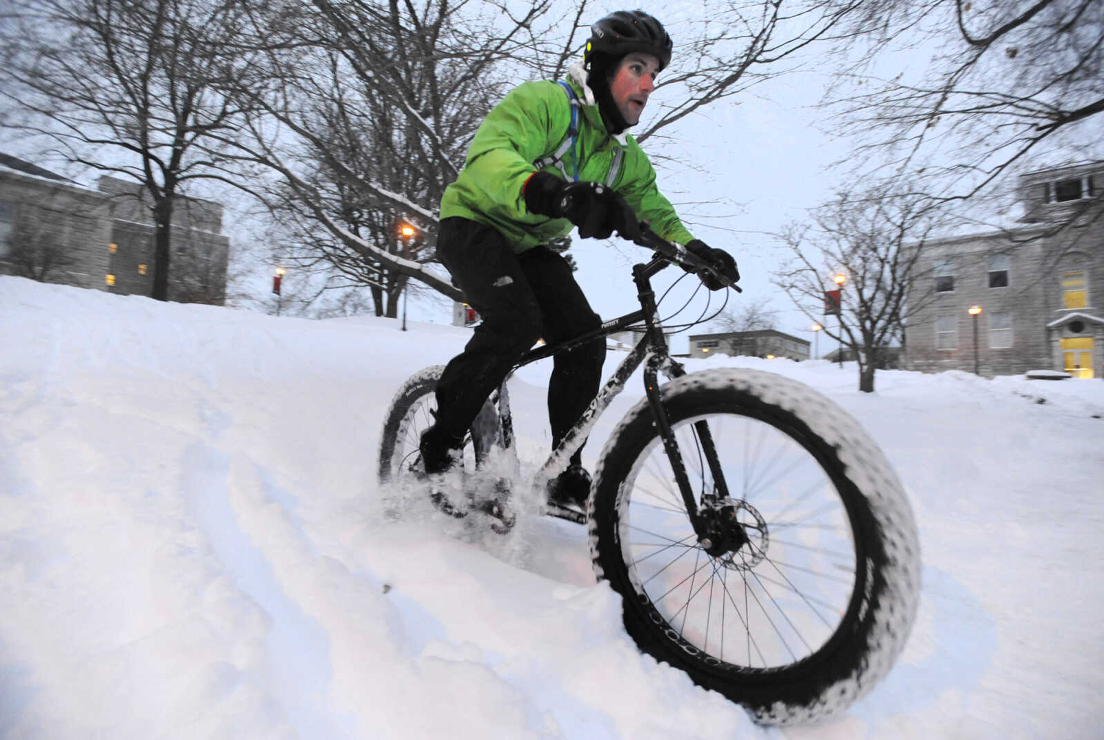 LAURA SIMON ~ lsimon@semissourian.com

Tim Vollink rides his fat bike through the snow on the terraces outside Academic Hall Tuesday evening, Feb. 17, 2015.