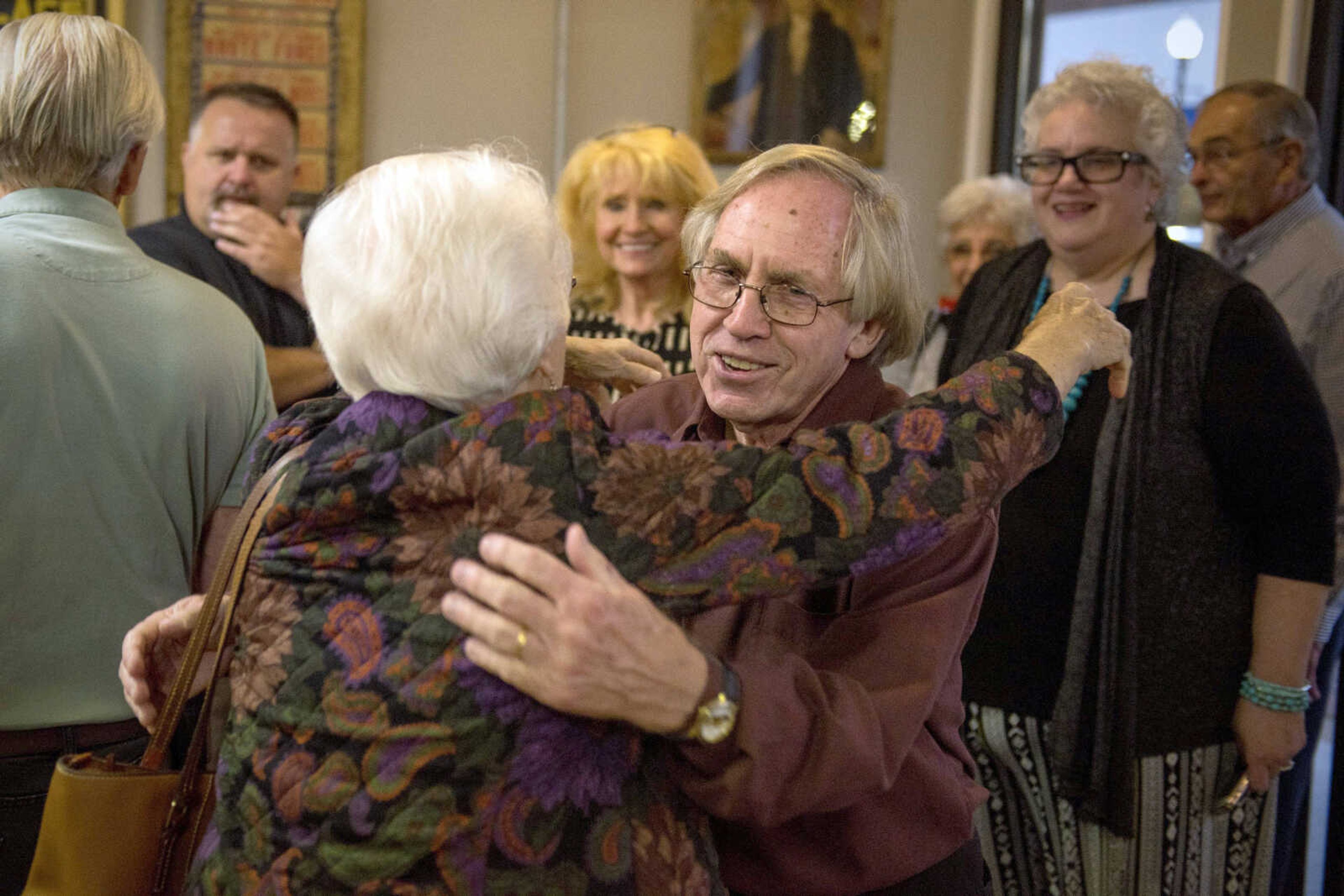 Jackson native and comic book creator Roy Thomas hugs Joan Battle, with whom he attended Jackson High School, on Friday during a visit at the Cape Girardeau County Historical Center in Jackson.