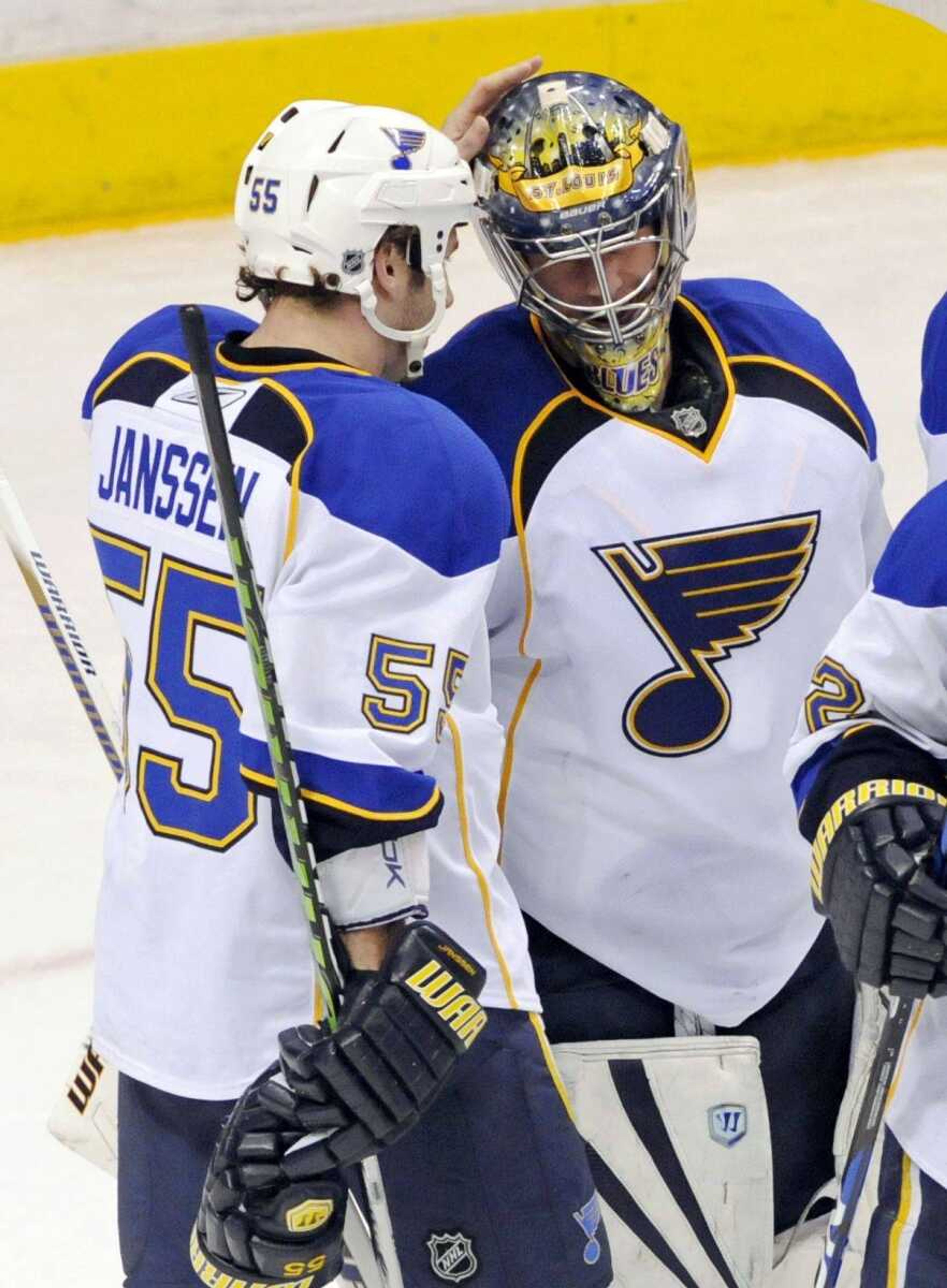 Blues goalie Ty Conklin is congratulated by Cam Janssen after the Blues beat the Wild 6-3 on Saturday in St. Paul, Minn. (JIM MONE ~ Associated Press)