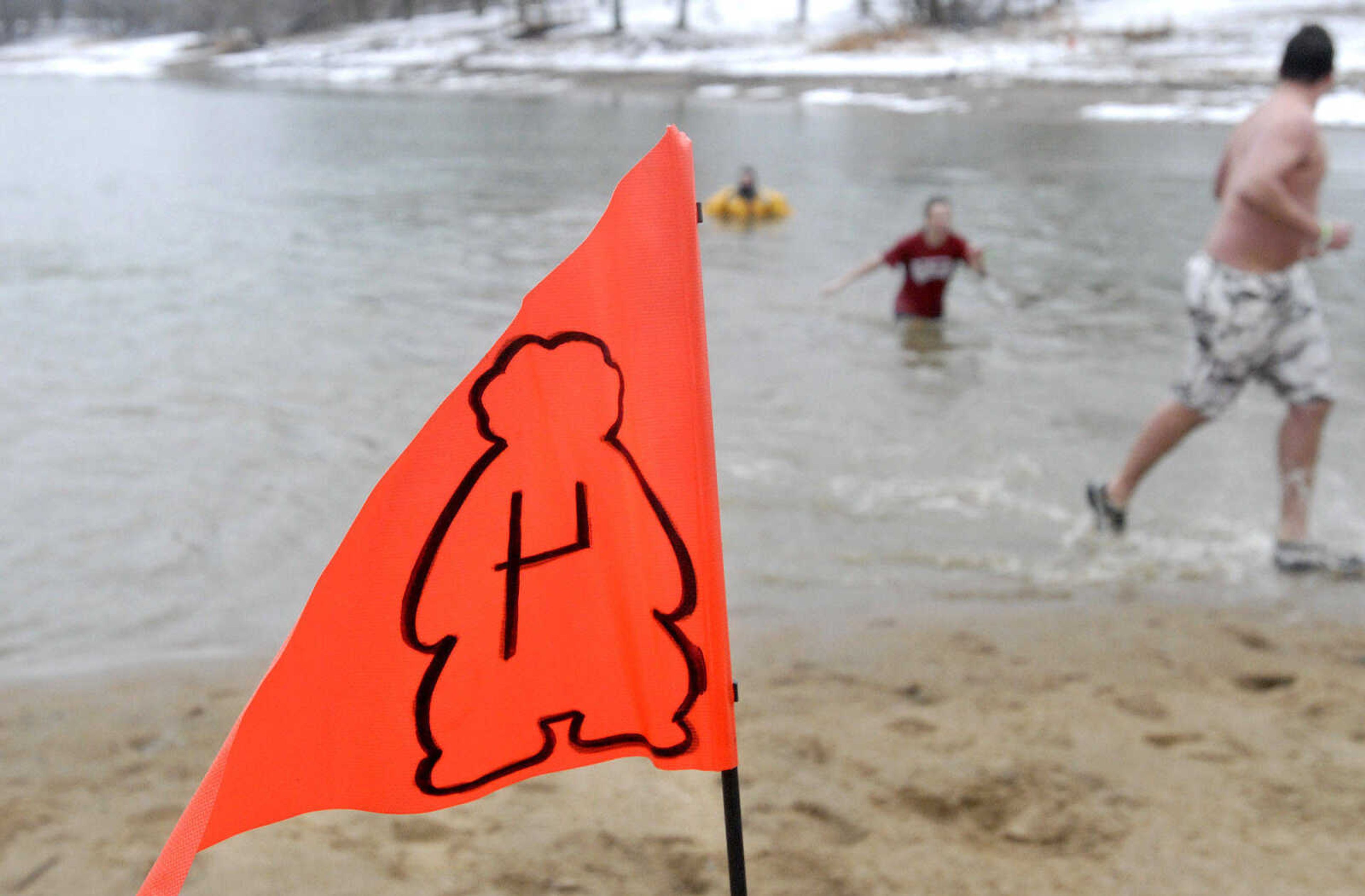 LAURA SIMON~lsimon@semissourian.com
Plungers run out of Lake Boutin Saturday, February 6, 2010 during the Polar Bear Plunge at Trail of Tears State Park.