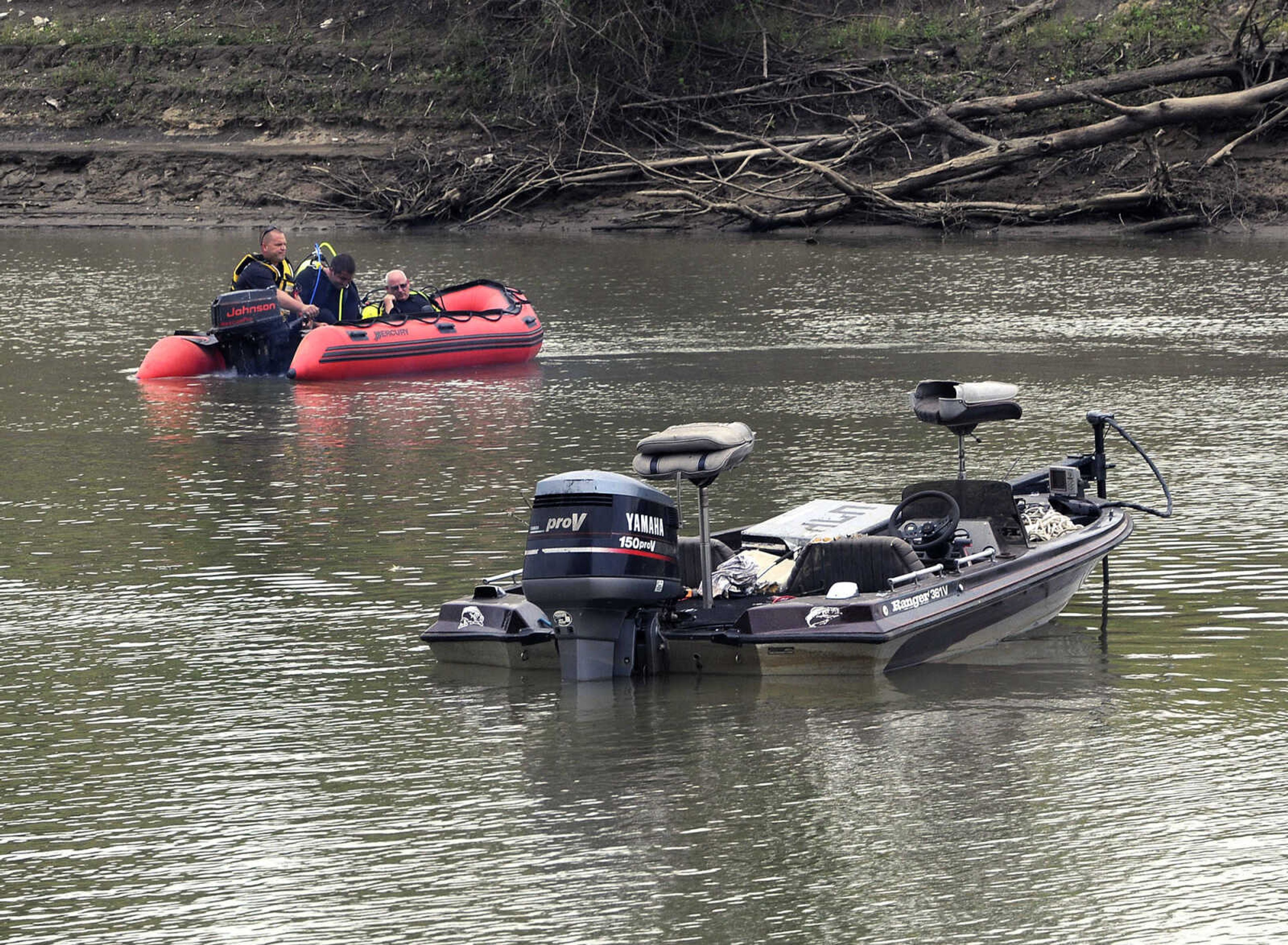 Members of the Cape Girardeau Fire Department's water rescue team approach an empty fishing boat while beginning a search for its driver Monday, Sept. 28, 2015, on the Diversion Channel south of Cape Girardeau. The body of the boater was found a couple of hours later. (Fred Lynch)