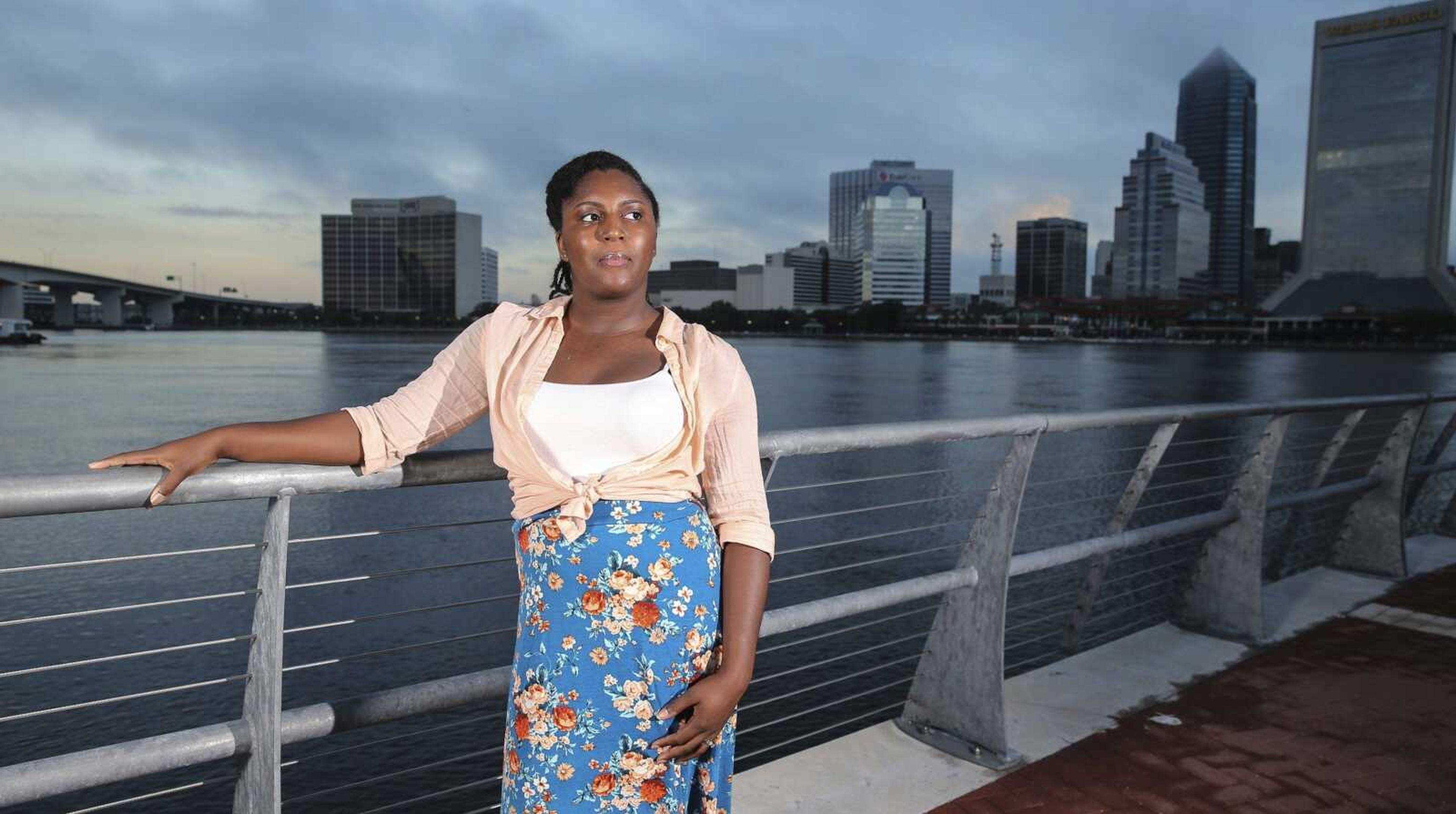 Asia Howard poses for a photo at St. Johns River Park at sunrise Oct. 20 in Jacksonville, Florida. Howard was stuck in mostly retail and fast-food jobs after graduating high school, unable to get a job in banking, a profession she prized for its steady hours. After further developing her career and computer skills, she landed a job in mortgage lending that paid nearly double what she earned in previous jobs. Howard now is studying for an associate degree in business administration at Florida State College at Jacksonville.