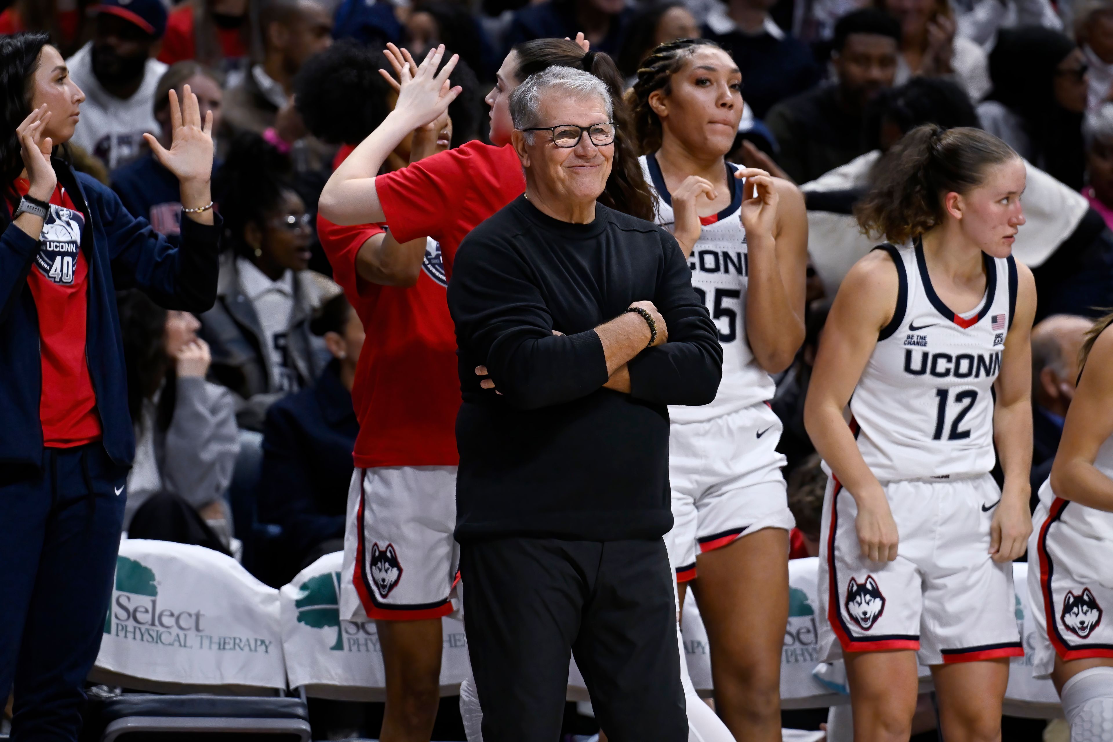 UConn head coach Geno Auriemma smiles and gestures after UConn forward Sarah Strong made a basket in the second half of an NCAA college basketball game against Fairleigh Dickinson, Wednesday, Nov. 20, 2024, in Storrs, Conn. (AP Photo/Jessica Hill)