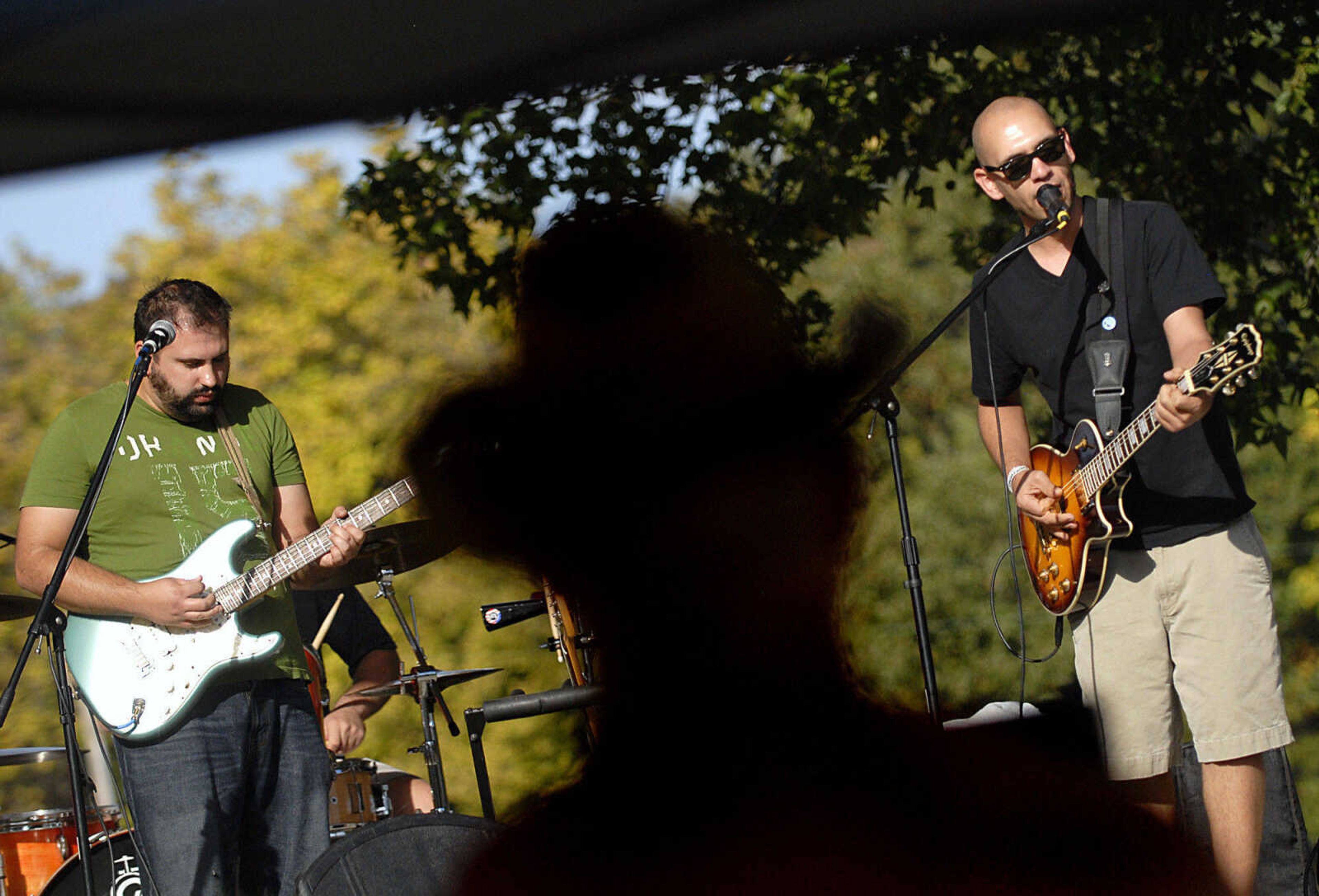 KRISTIN EBERTS ~ keberts@semissourian.com

Noah Leiner, left, and Jon Schumacher, right, members of Noah Leiner and the Sneaker Bombs, perform during the Leiner Music Festival in Scott City Park on Saturday, Oct. 8, 2011. Proceeds from the festival will go towards building the Leiner Amphitheater.