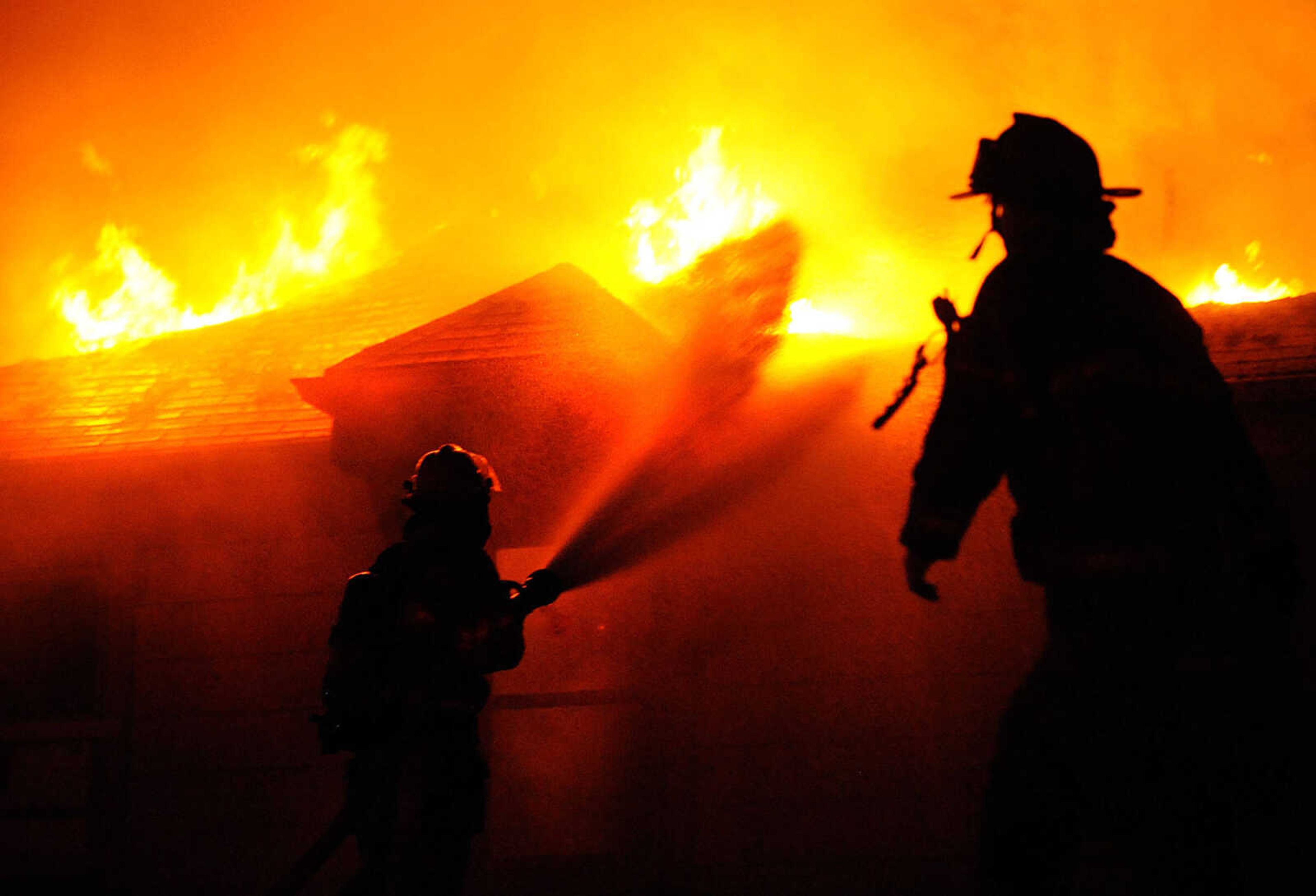 LAURA SIMON ~ lsimon@semissourian.com
Fire fighters from Delta, Gordonville, Cape Girardeau, Millersville, Fruitland and East County Fire Departments battle a structure fire Wednesday night, January 9, 2012 on Onyx Lane in Cape Girardeau.