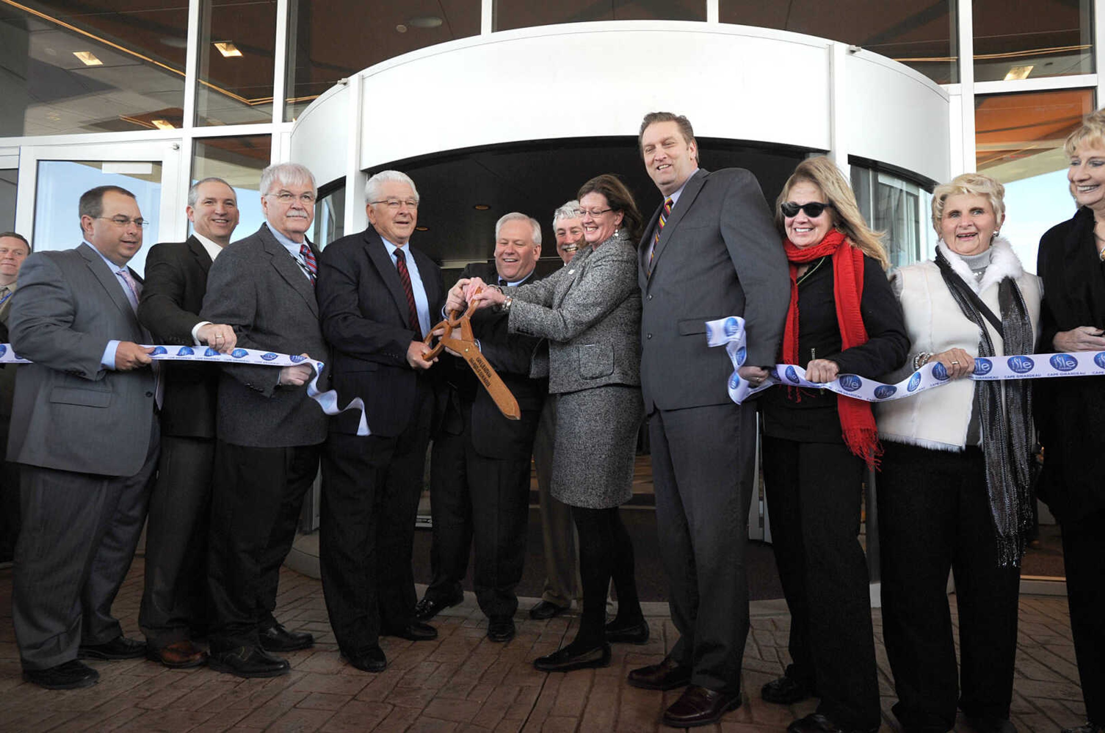 LAURA SIMON ~ lsimon@semissourian.com
From left, Cape Girardeau City Councilman Mark Lanzotti, Councilman John Voss, Isle of Capri Vice President aof design and construction Dick Meister, Isle Casino Cape Girardeau General Manager Chet Koch, David Knight, Isle of Capri President and CEO Virginia McDowell, City Manager Scott Meyer, Mary Gaertner, Councilwoman Loretta Schneider and Councilwoman Kathy Swan cut the ribbon Tuesday, Oct. 30, 2012 during the opening day of Isle Casino Cape Girardeau.