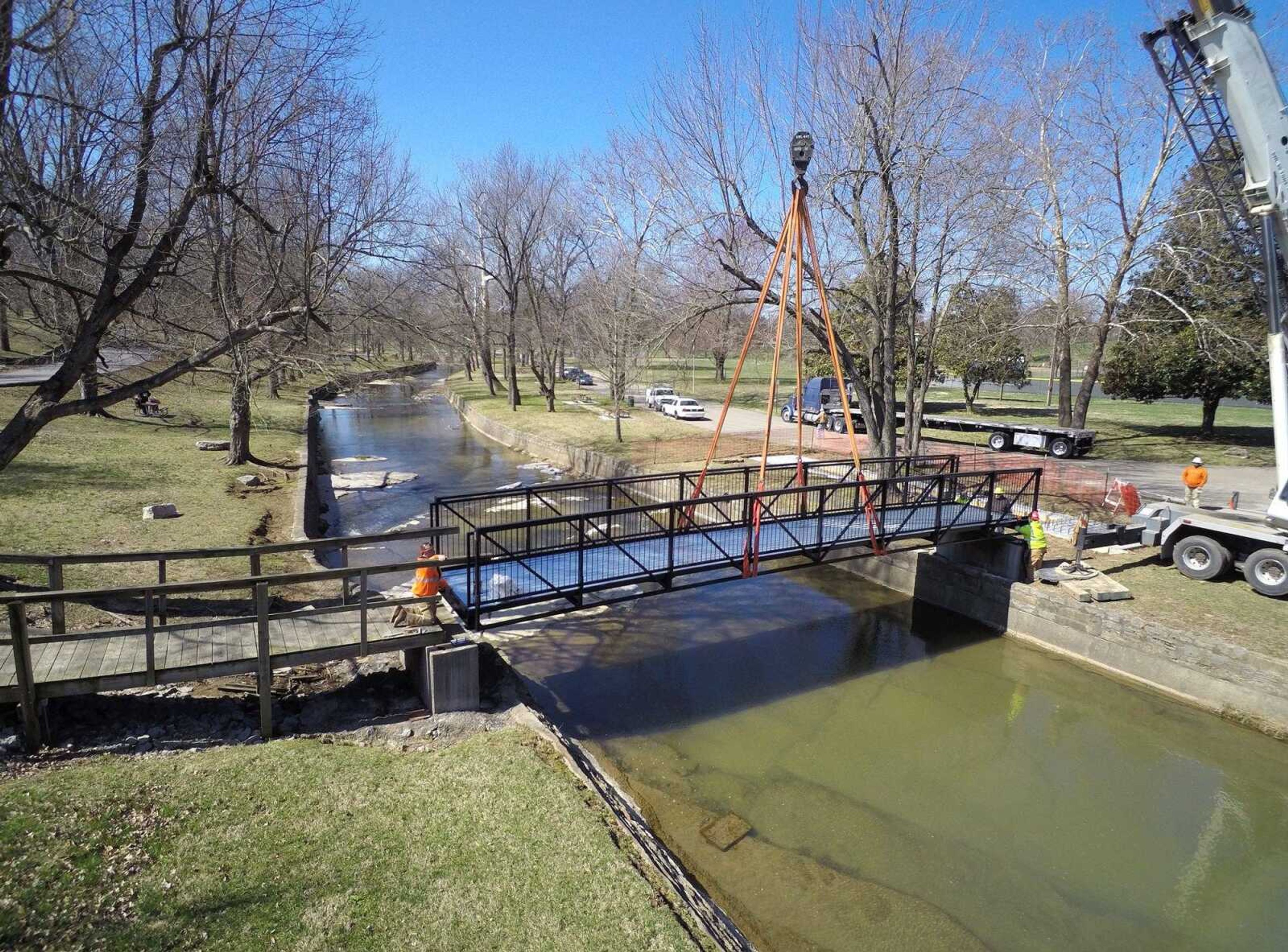 A new footbridge is installed over Hubble Creek in this drone view Tuesday at Jackson City Park.