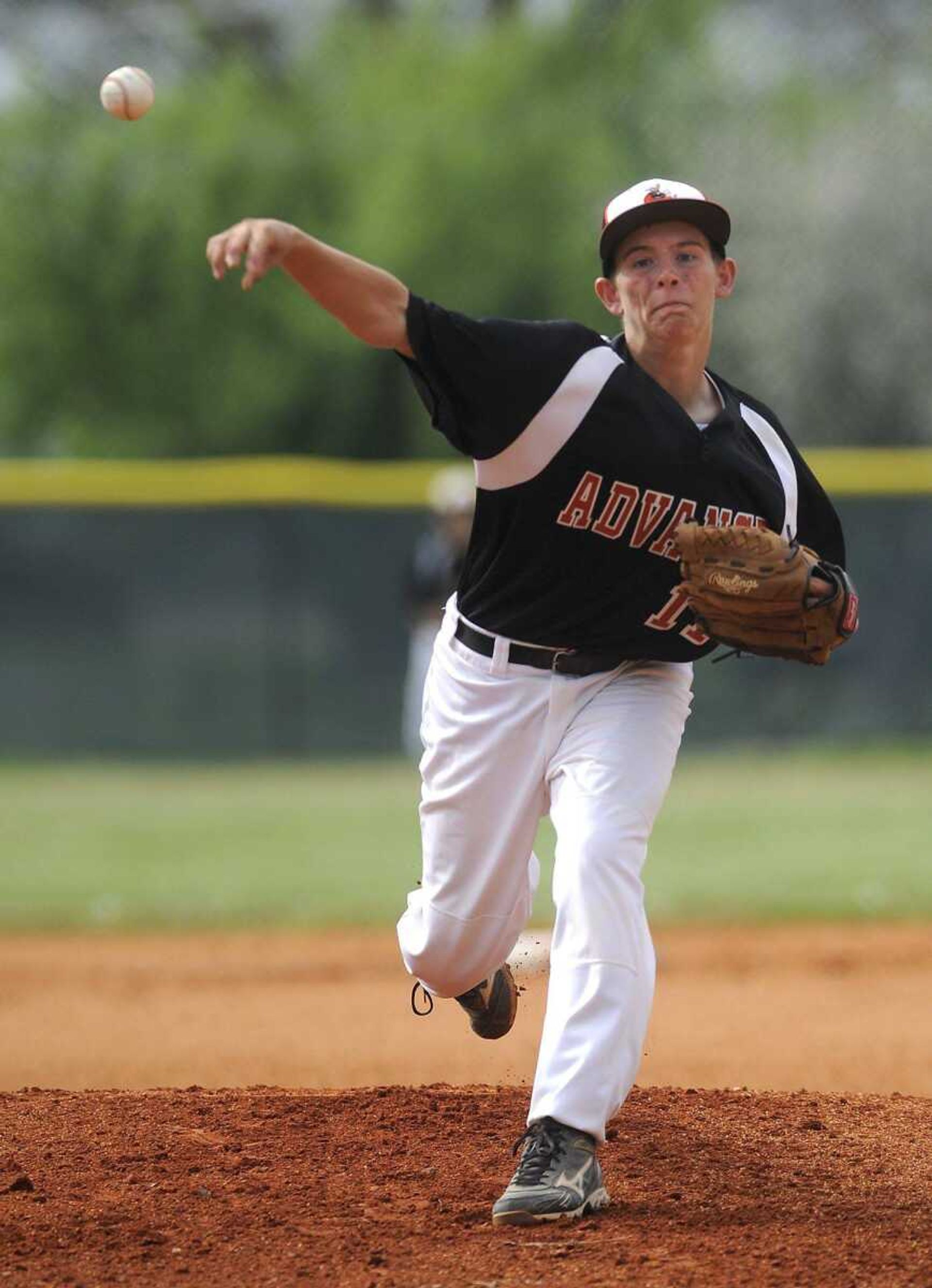 Advance starter Brian Whitson pitches to a Woodland batter during the second inning Monday. Whitson allowed just two hits in throwing a shutout.