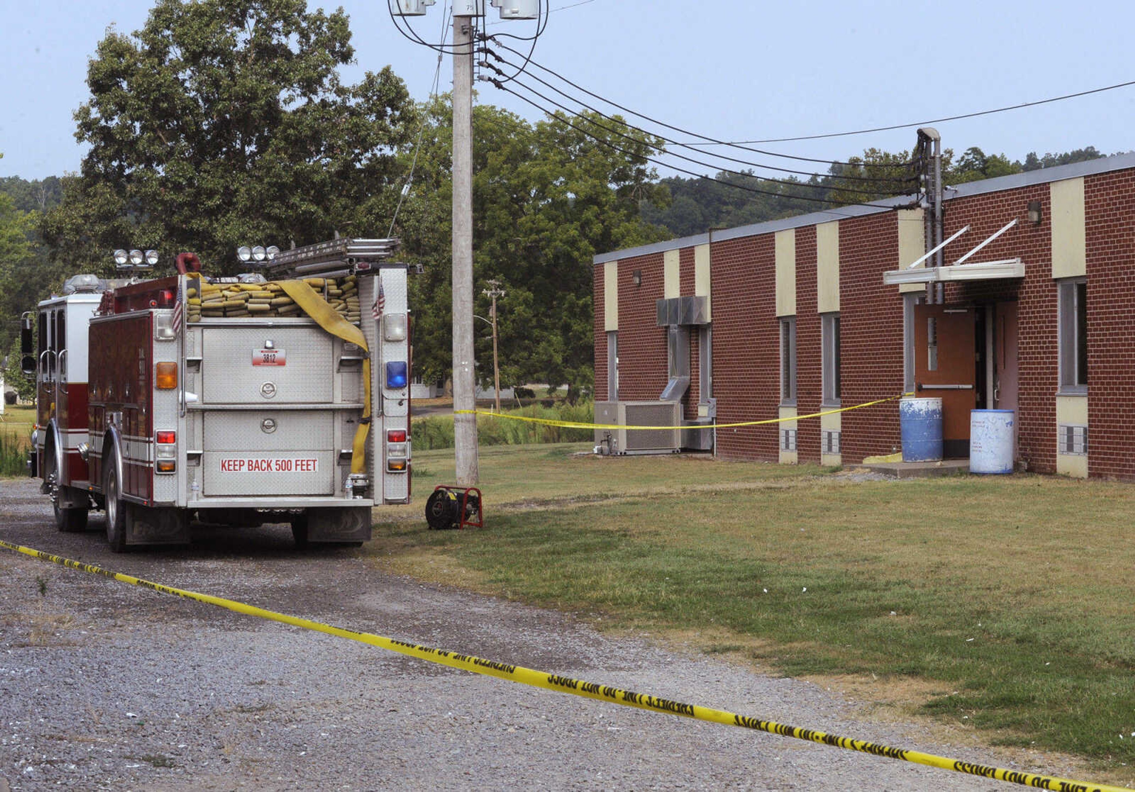 A fire truck sits outside Delta High School following a fire Friday morning, Aug. 13, 2010. (Fred Lynch)