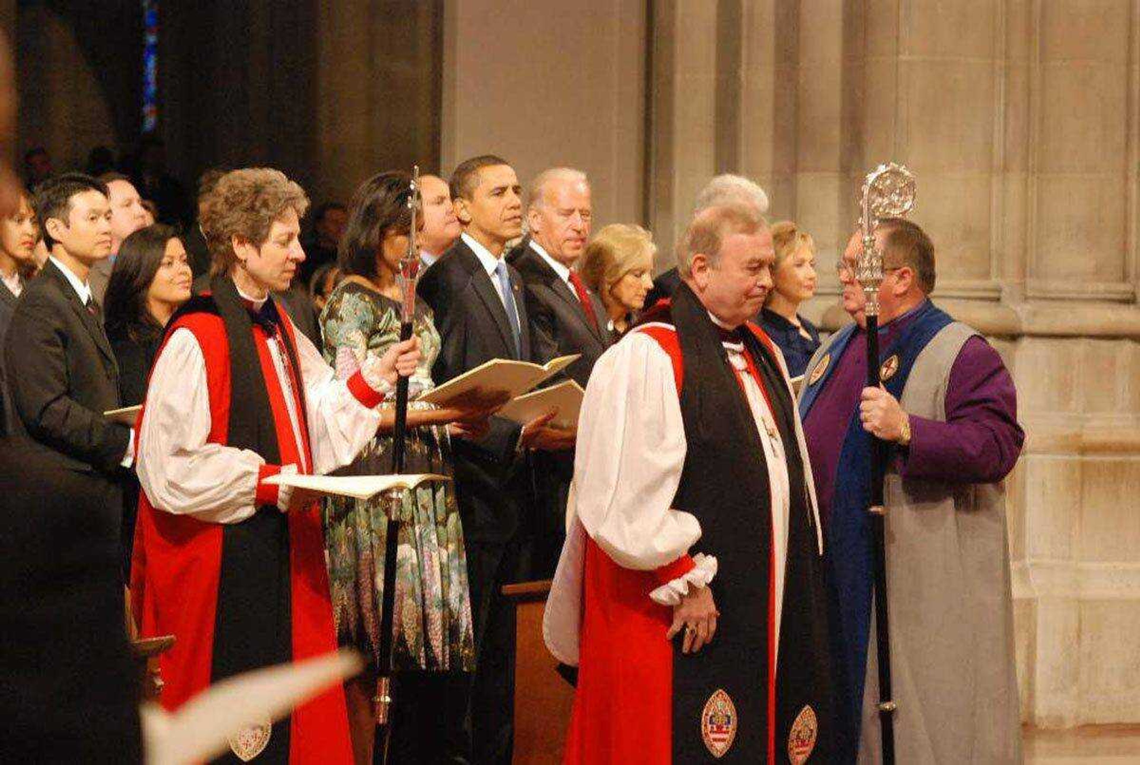 Presiding Bishop Katharine Jefferts Schori and Episcopal Diocese of Washington Bishop John Chane process into the National Prayer Service at Washington National Cathedral Jan. 21 as Michelle Obama, Barack Obama, Joe Biden, Jill Biden, Bill Clinton (obscured) and Hillary Rodham Clinton wait. (Richard Schori ~ Submitted Photo)