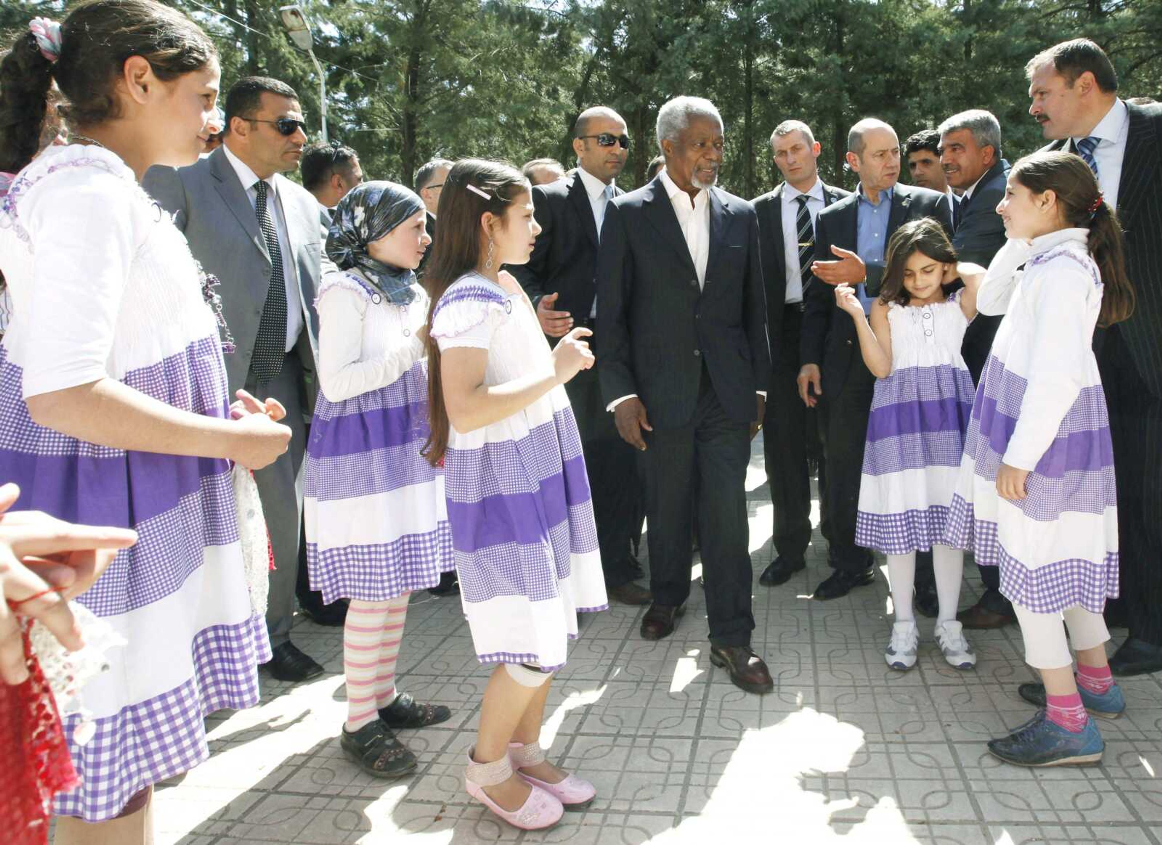 U.N.-Arab League envoy Kofi Annan, center, is welcomed by Syrian refugee children upon his arrival Tuesday at Yayladagi refugee camp in Hatay province, Turkey. (Umit Bektas, Pool ~ Associated Press)