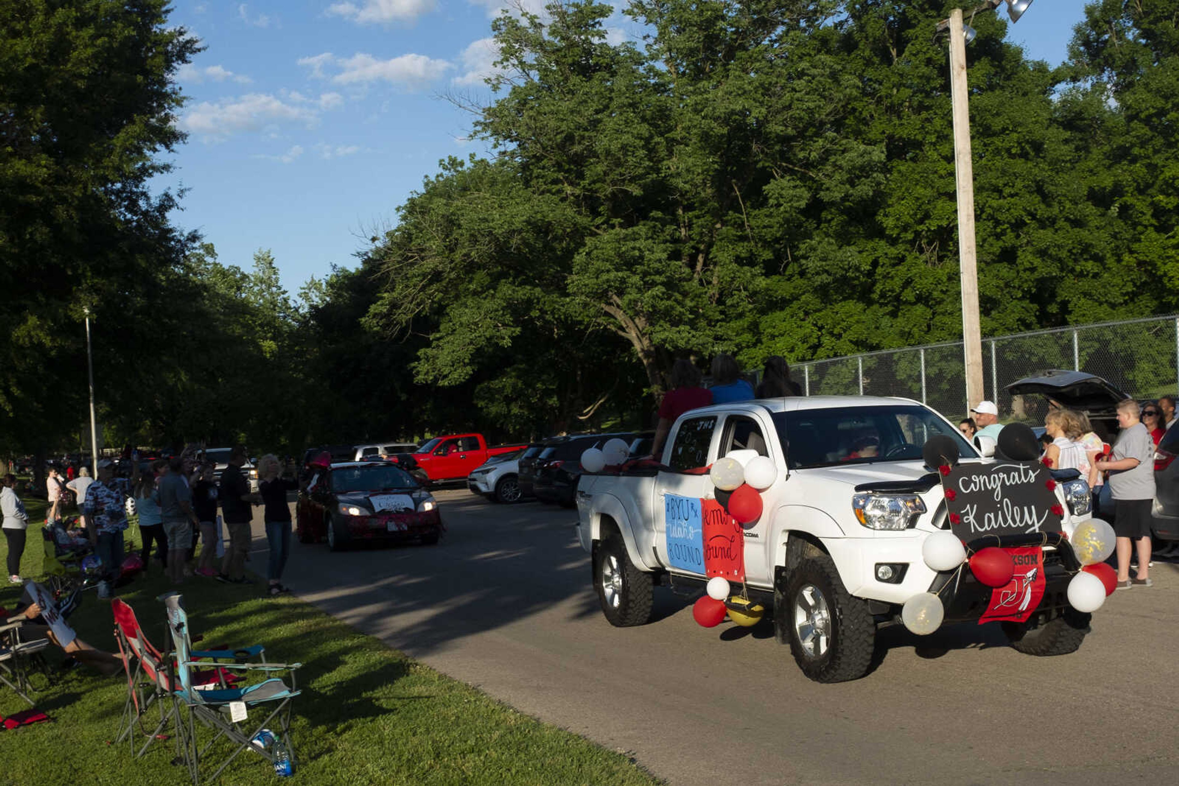 People take part in a parade for Jackson High School seniors Friday, May 29, 2020, at Jackson City Park.