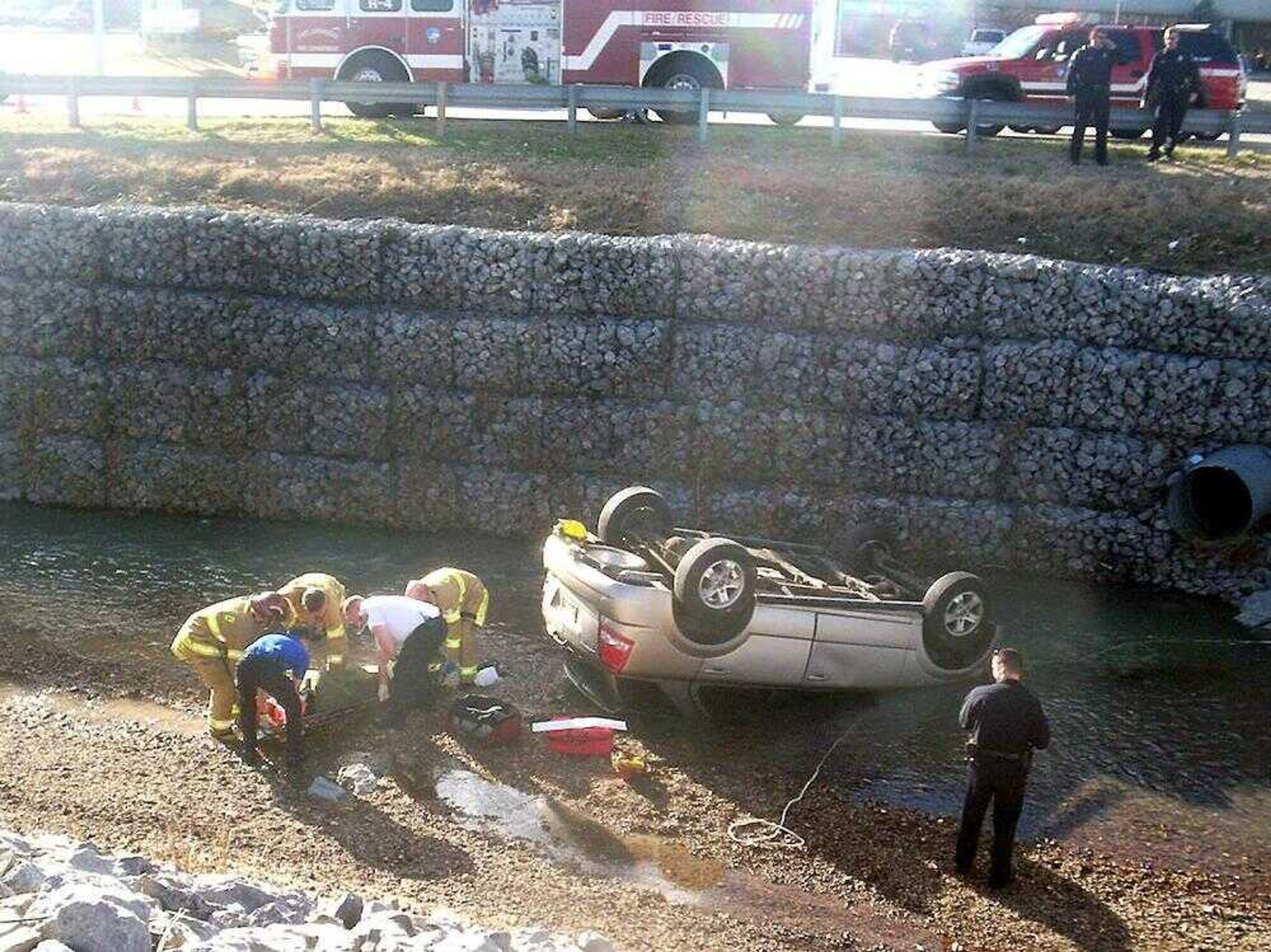 A sport utility vehicle southbound on Mount Auburn Road overturned into Cape La Croix Creek when the driver reportedly lost consciousness Friday afternoon. (Photo by Matthew Tygett)