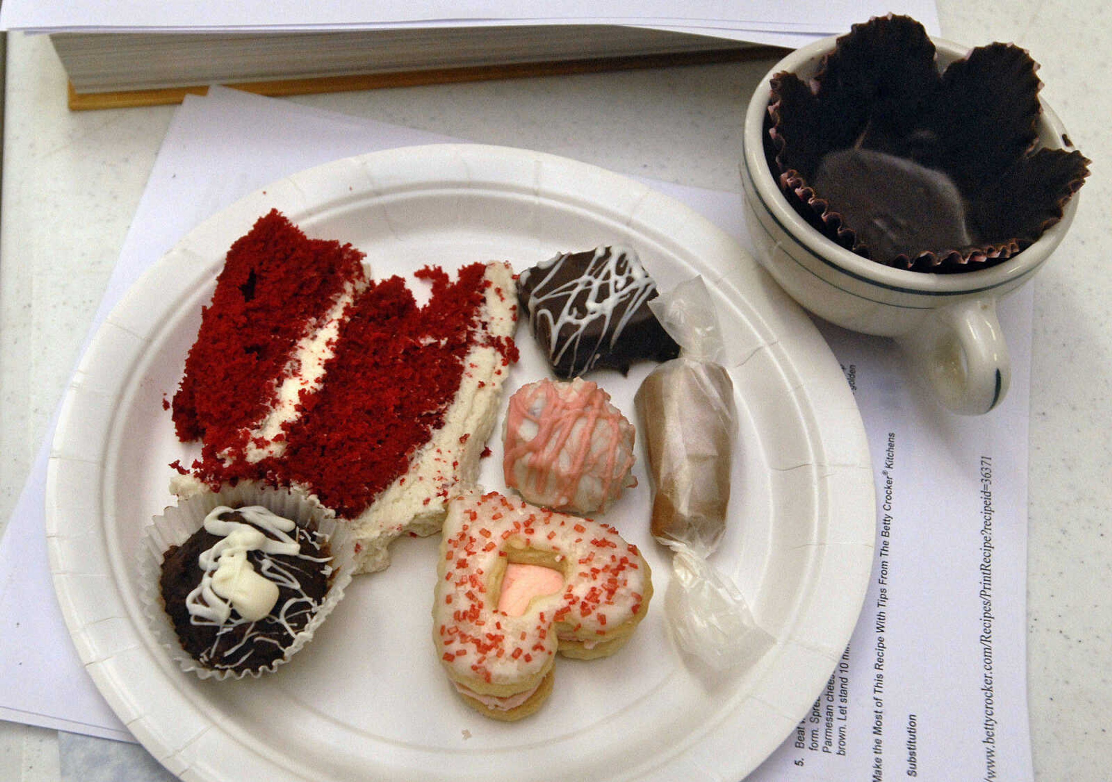 LAURA SIMON~lsimon@semissourian.com
Looks like the breakfast of champions! Finished products wait to be sampled and shared Saturday, February 5, 2011. Red velvet cake, Texas Millionaires, caramels, red velvet cake balls, brandied eggnog cookies, and a chocolate cup.