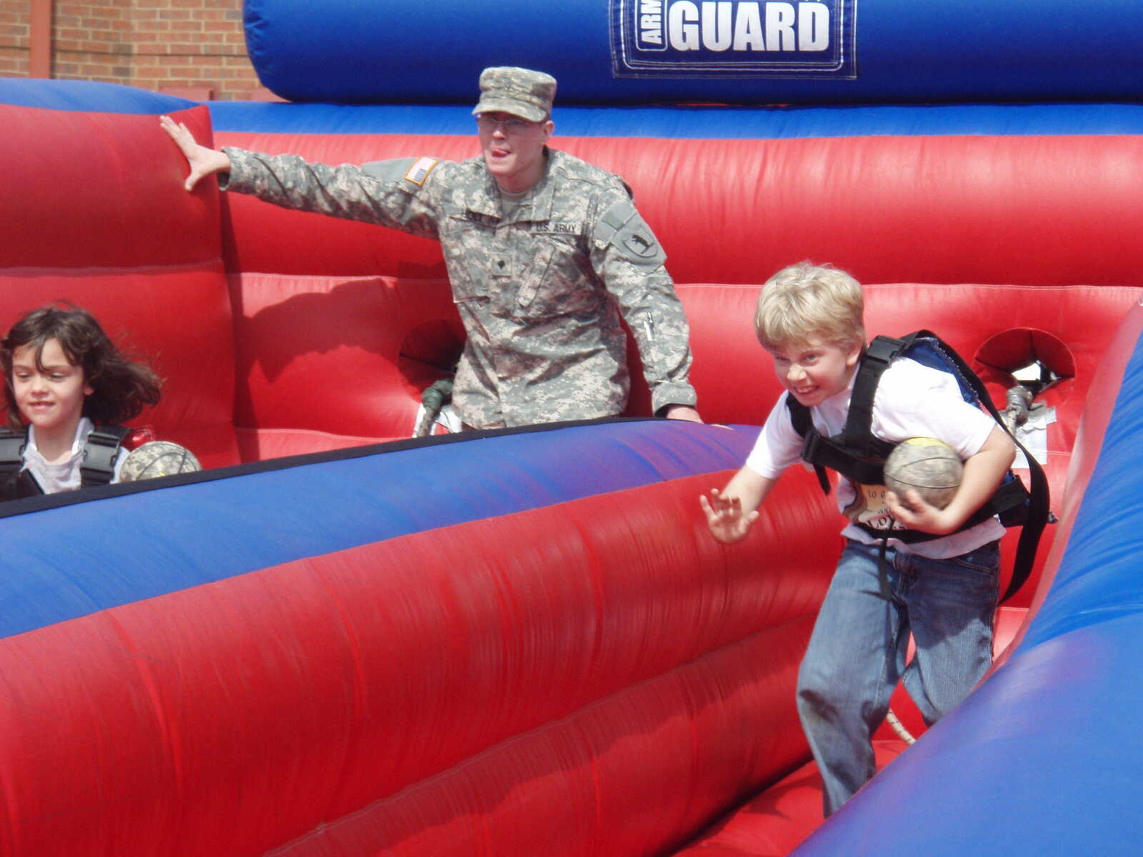 Spc. Jonathan Holt of the 735th Force Provider Co. was one of several volunteers who helped at the 1st Annual Children's Fair.