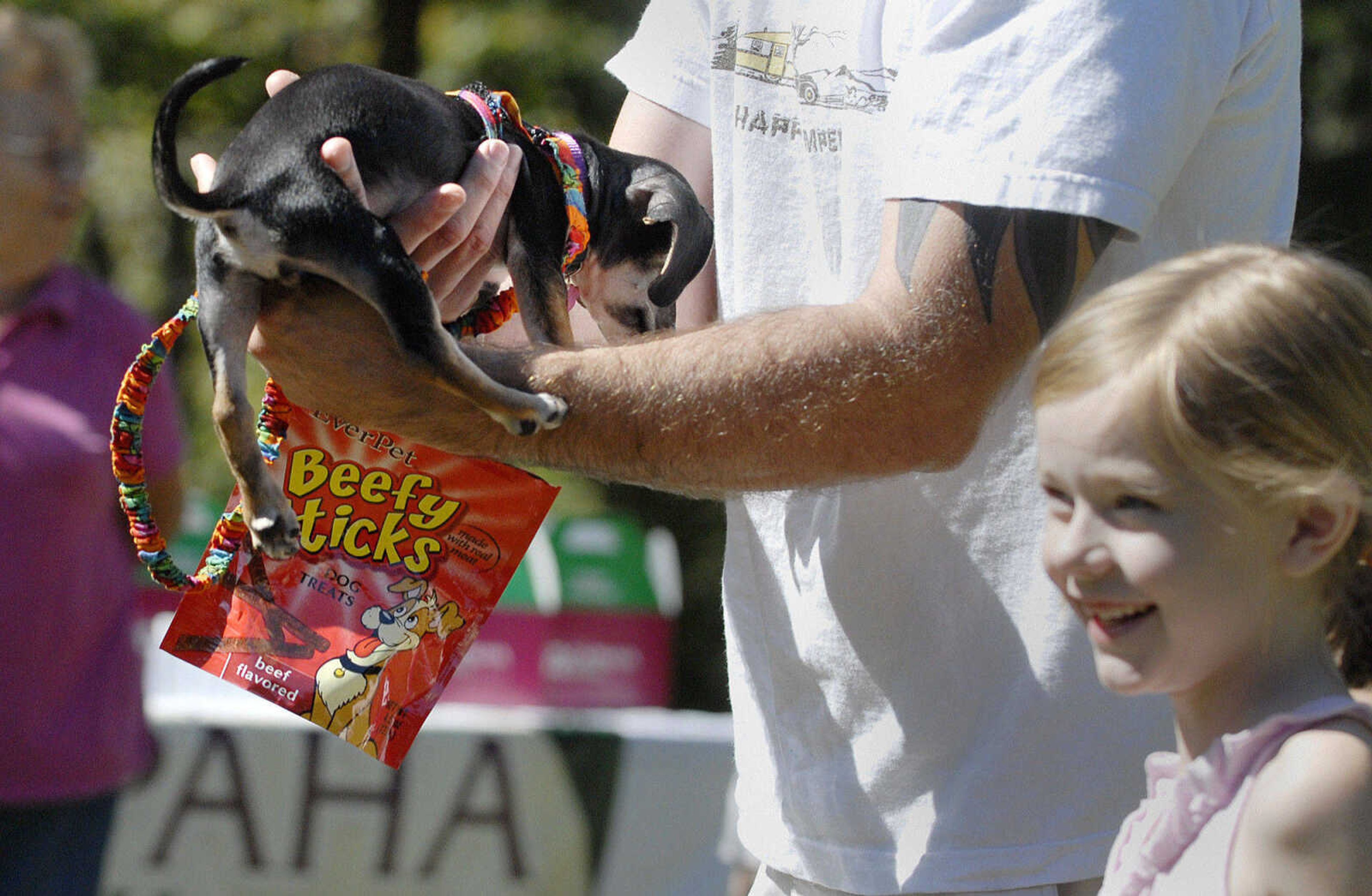 LAURA SIMON~lsimon@semissourian.com
Eight-year-old Julia Suderman stands next to her father Curtis as he wags Molly's tail for the judges Saturday, September 25, 2010 during Bark in the Park at Kiwanis Park in Cape Girardeau.