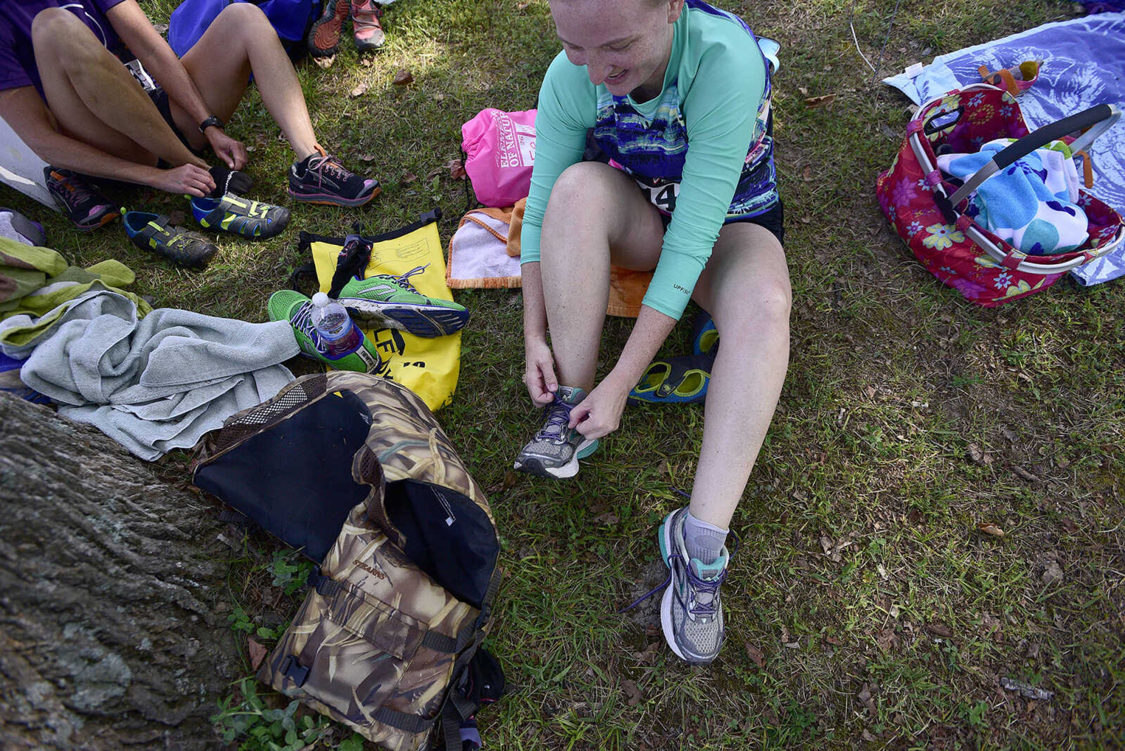 Participants change into running shoes after kayaking on Lake Boutin during the first ever St. Jude Heroes Yak 'n Run on Saturday, Aug. 26, 2017, at Trail of Tears State Park. All proceeds from the event support St. Jude Children's Research Hospital