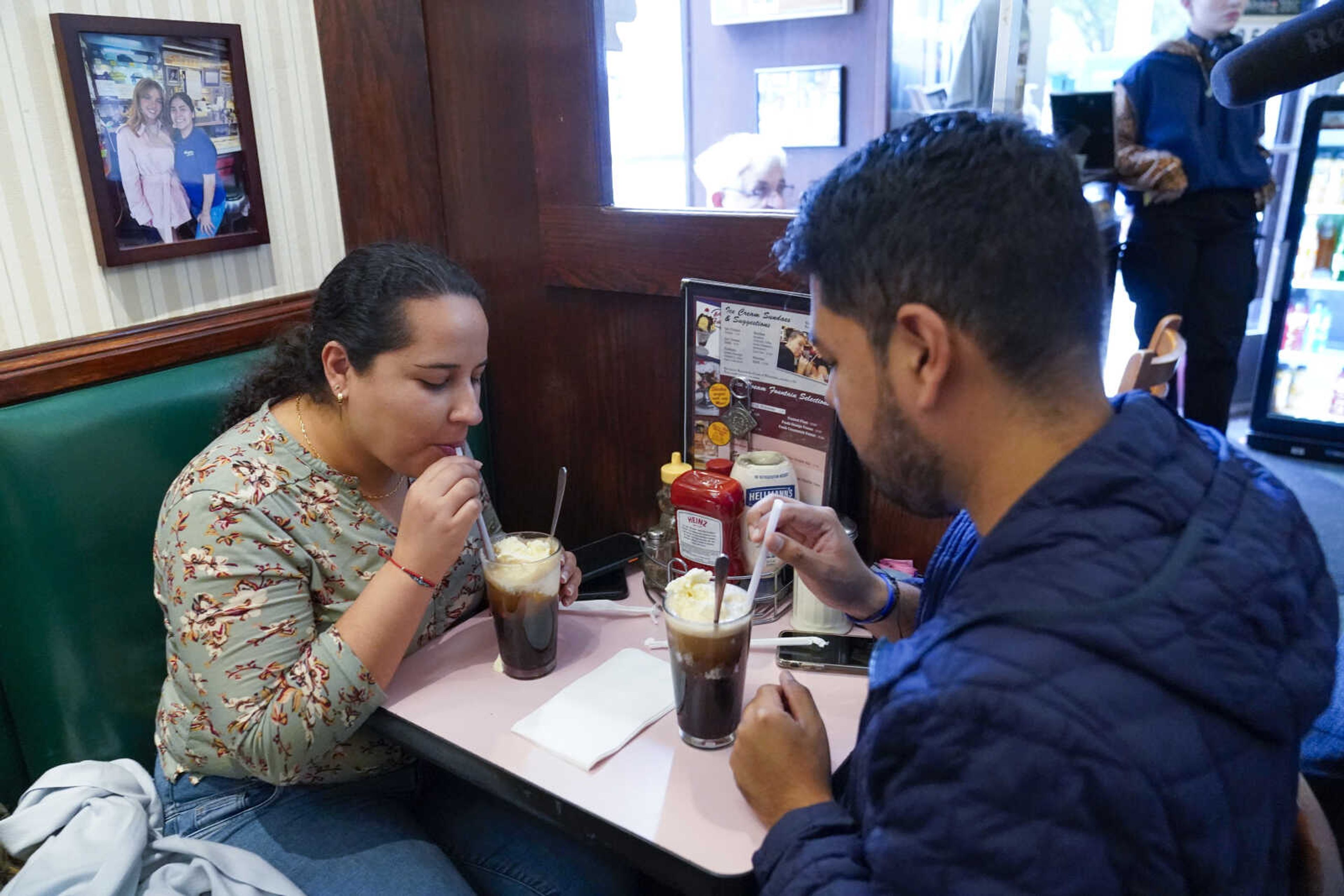 Customers enjoy Coke floats at the Lexington Candy Shop on Sept. 28 in New York.