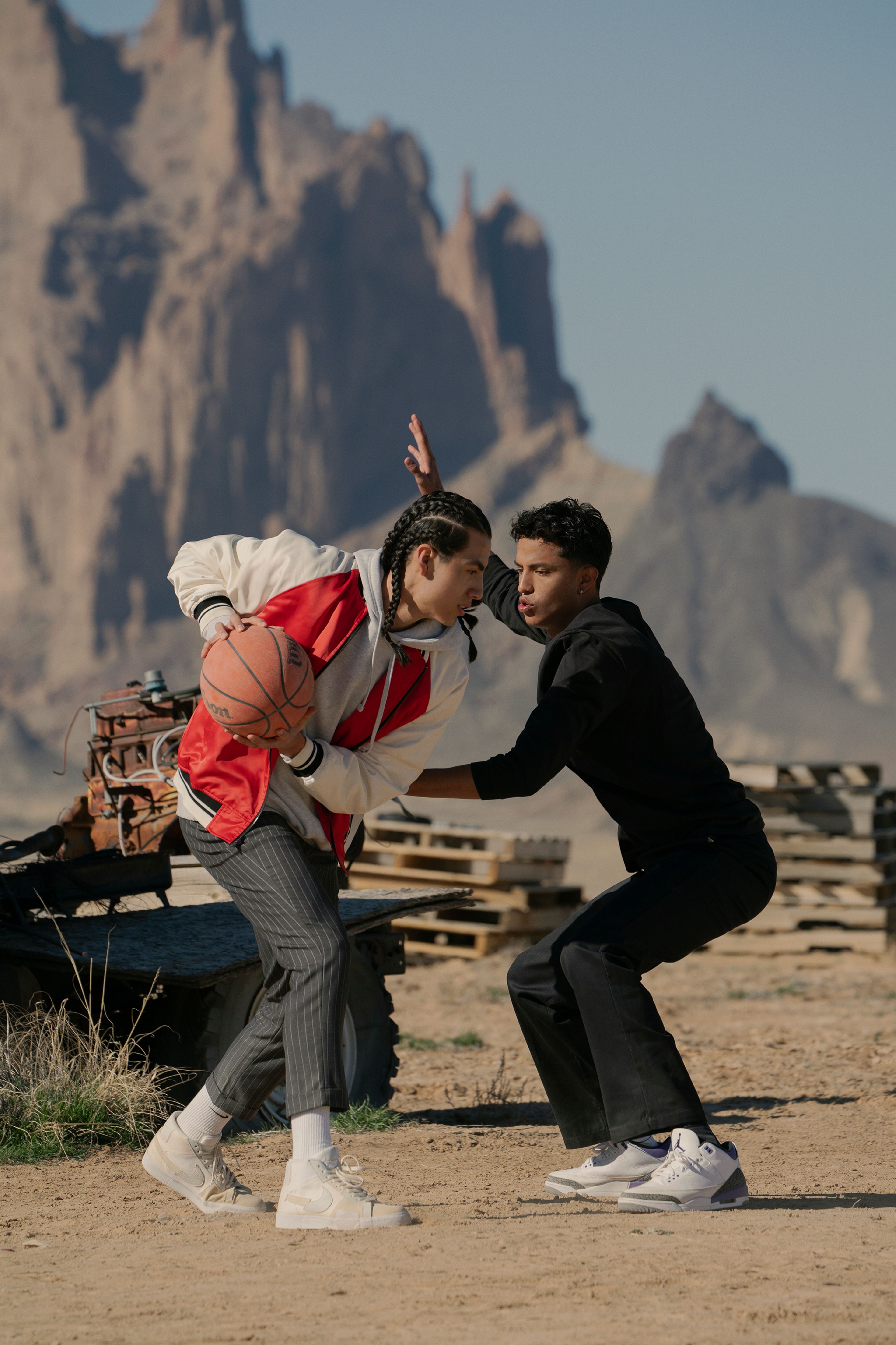 This image released by Netflix shows Kusem Goodwind as Nataanii, left, and Kauchani Bratt as Jimmy, in a scene from the film "Rez Ball." (Lewis Jacobs/Netflix via AP)