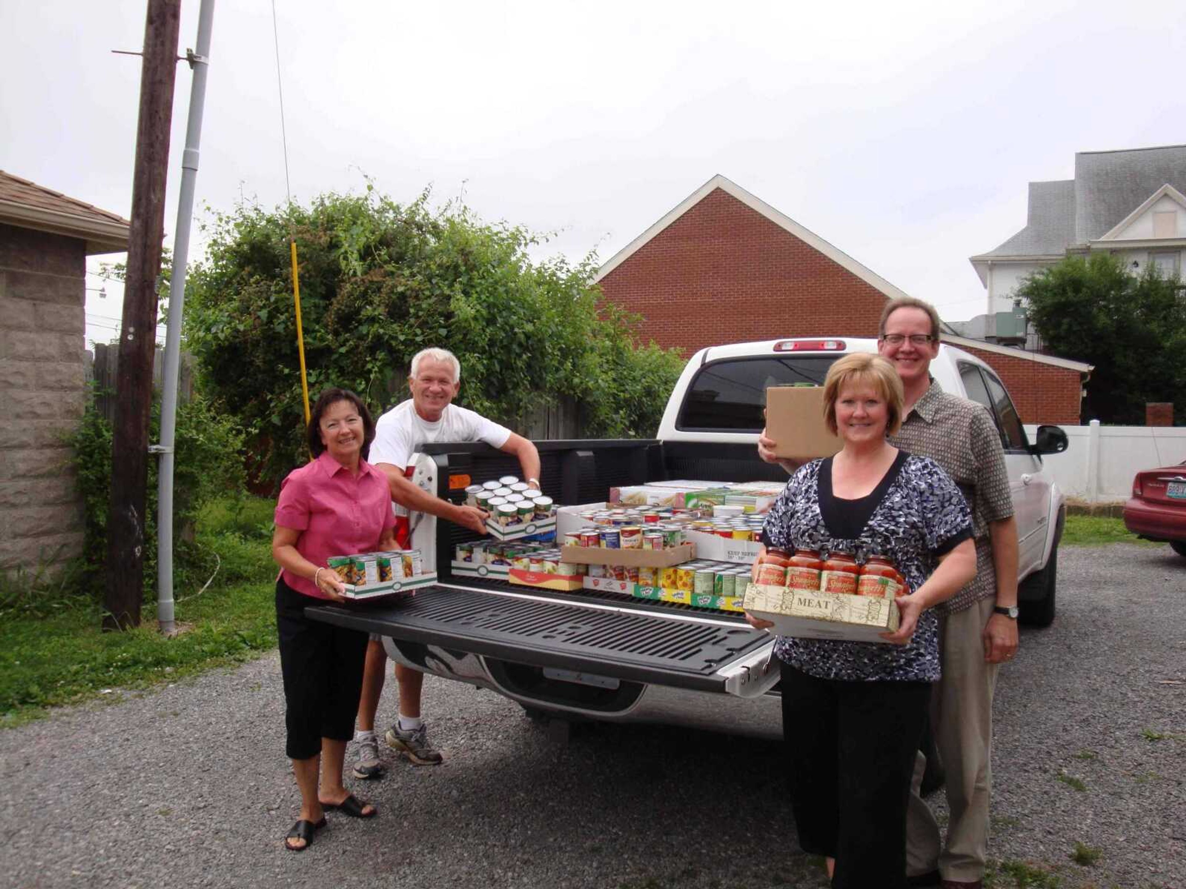 Delivering canned food to the FISH Pantry are from left to right: Kathy Grable, Fred Grable, Lorrie Shaffer and Chris Goeke