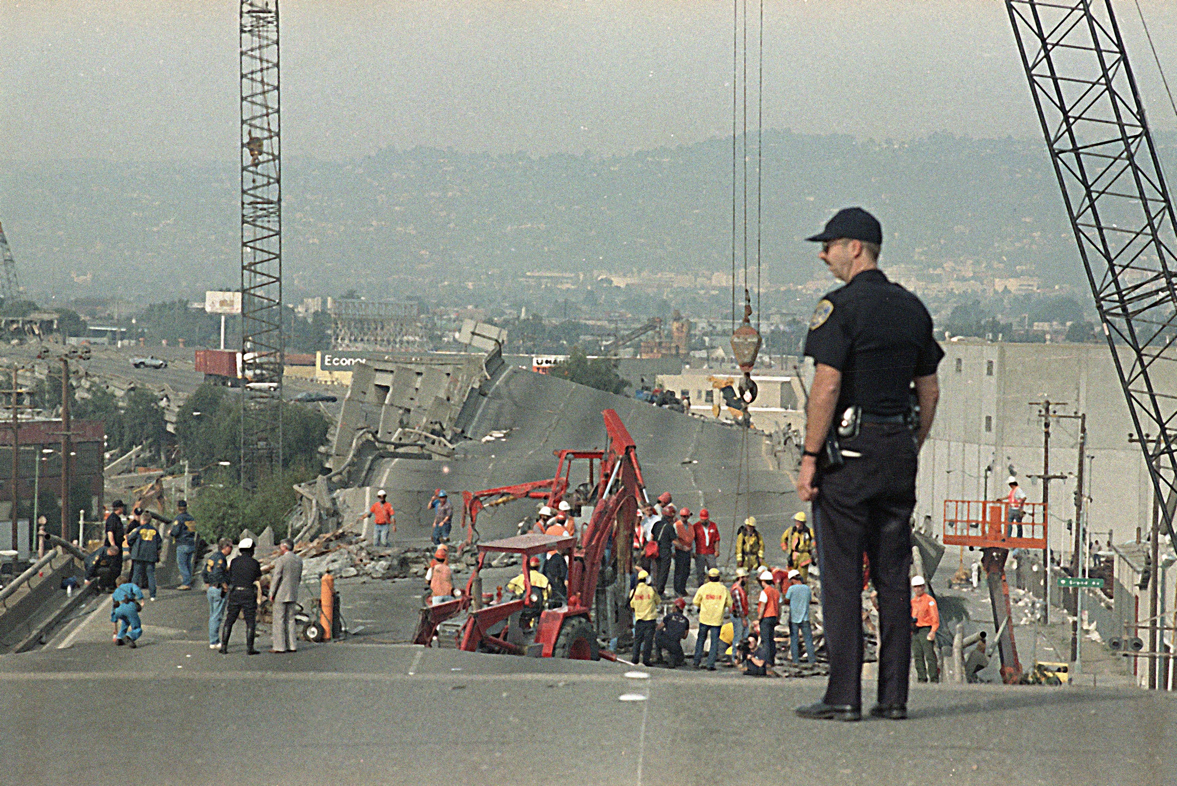 Workers continue the cleanup operation on I-880 in Oakland Monday, October 19, 1989. The freeway was heavily damaged in Tuesday's earthquake. 