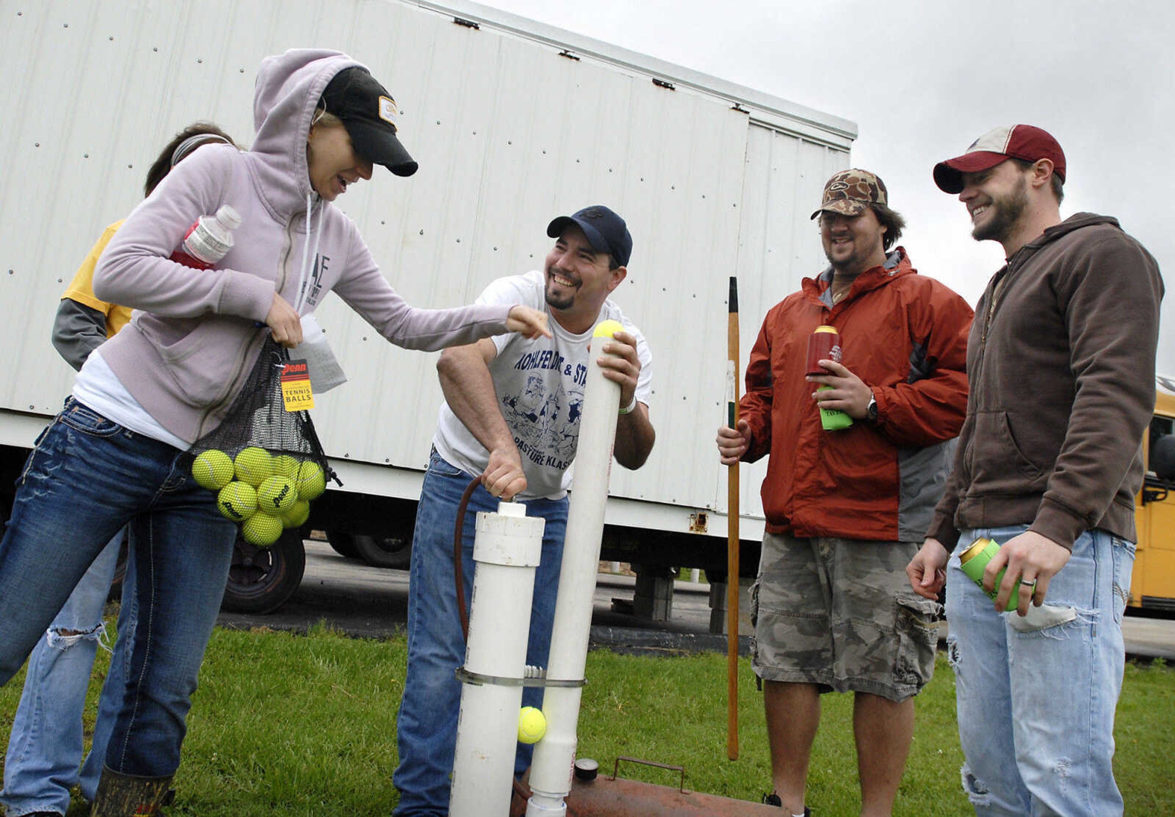 KRISTIN EBERTS ~ keberts@semissourian.com

From left, Lacey Job, Darrin Beal, Zach Arnold and Brandon Job prepare their potato gun for tee-offduring the Kow Pasture Klassic at Schlinder's Tavern in New Hamburg, Mo., on Saturday, May 14, 2011. Proceeds from the event benefit the Kenny Rogers Children's Center and the Missouri Veterans Home.