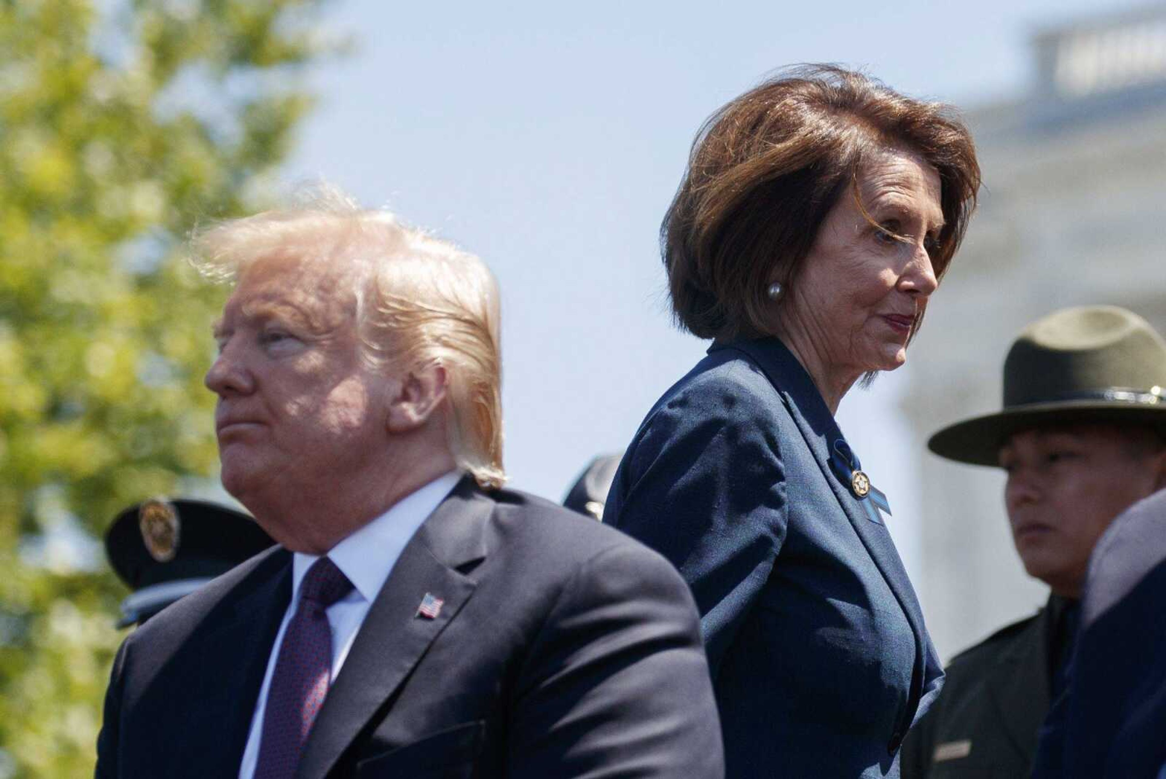 President Donald Trump and Speaker of the House Nancy Pelosi of California attend the 38th annual National Peace Officers' Memorial Service on Wednesday at the U.S. Capitol in Washington. Pelosi said Wednesday the U.S. must avoid war with Iran.