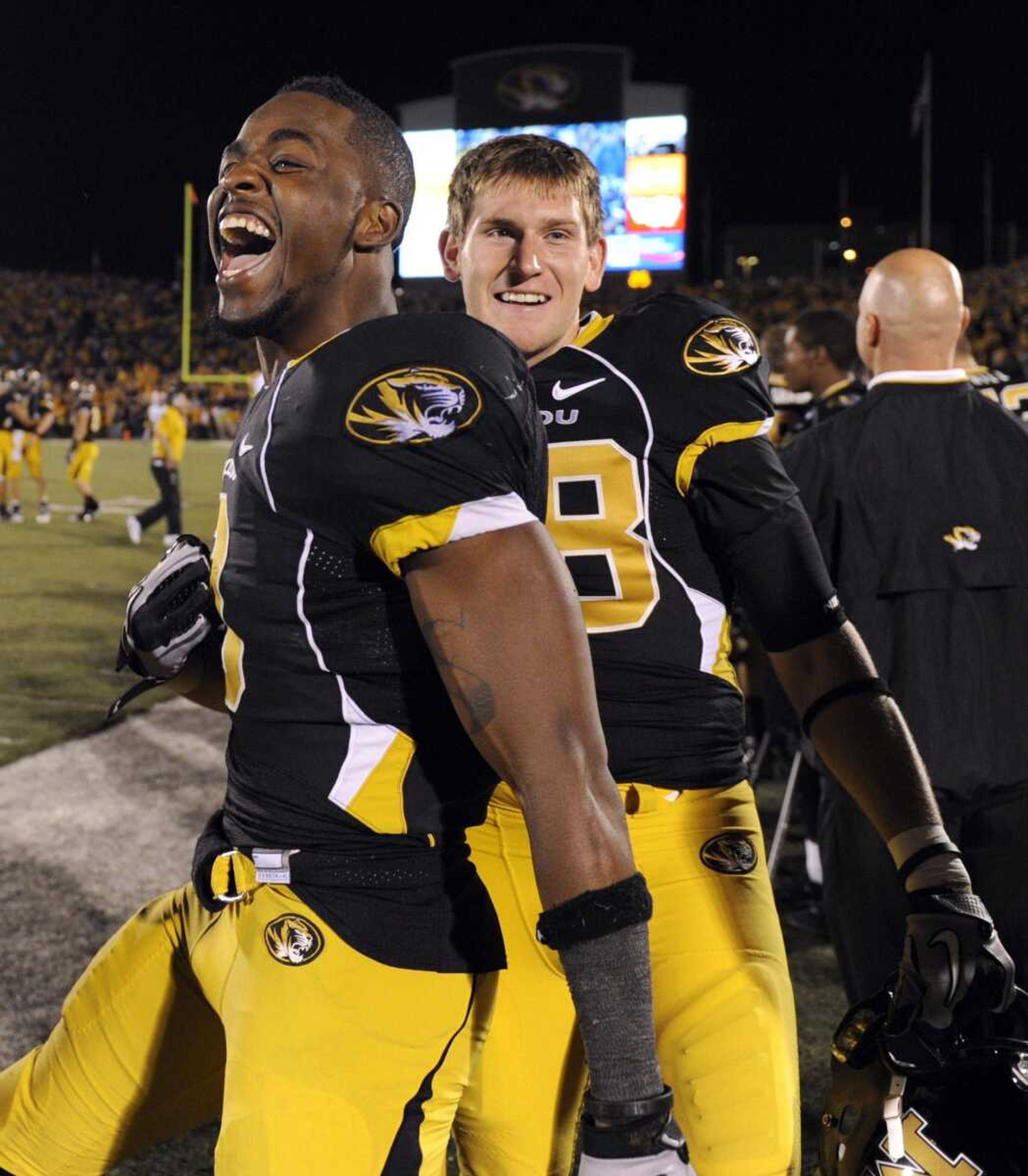 Missouri's Gahn McGaffie, left, and teammate Forrest Shock celebrate on the sidelines in the final seconds in the Tigers' 36-27 victory over the Oklahoma Sooners in an NCAA college football game Saturday, Oct. 23, 2010, in Columbia, Mo. (AP Photo/L.G. Patterson)