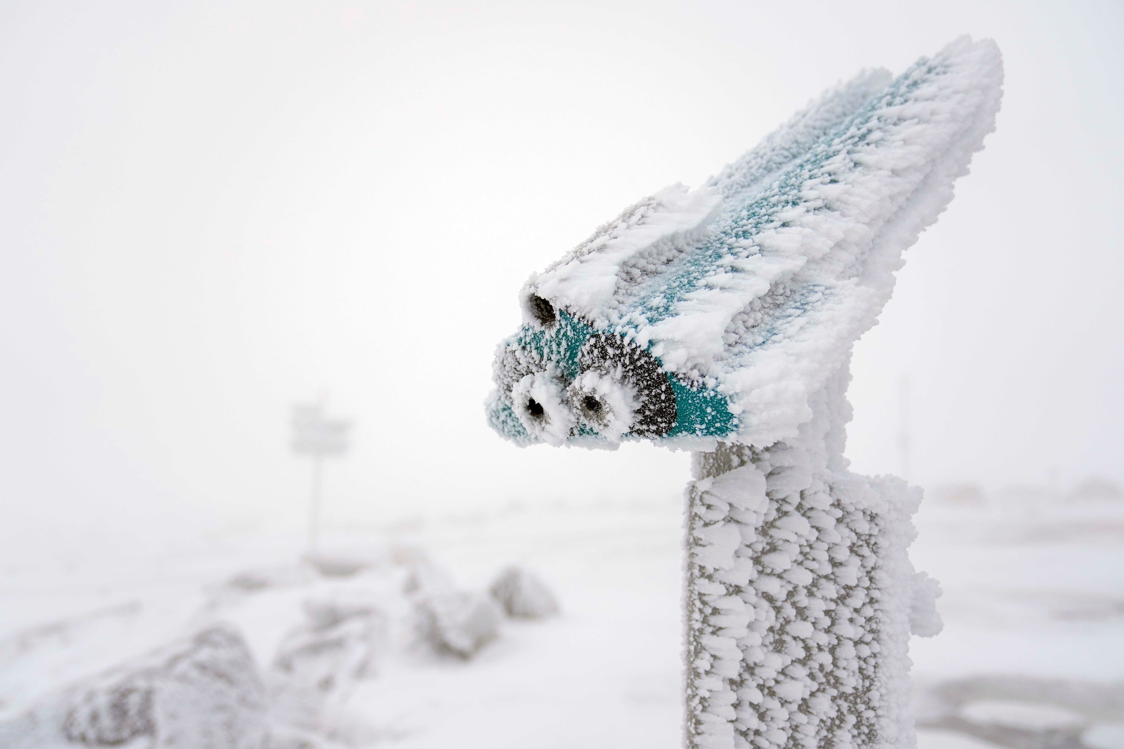 A snow covered telescope stands on northern Germany's 1,142-meter (3,743 feet) highest mountain 'Brocken' at the Harz mountains near Schierke, Germany, Wednesday, Nov. 20, 2024. (AP Photo/Matthias Schrader)