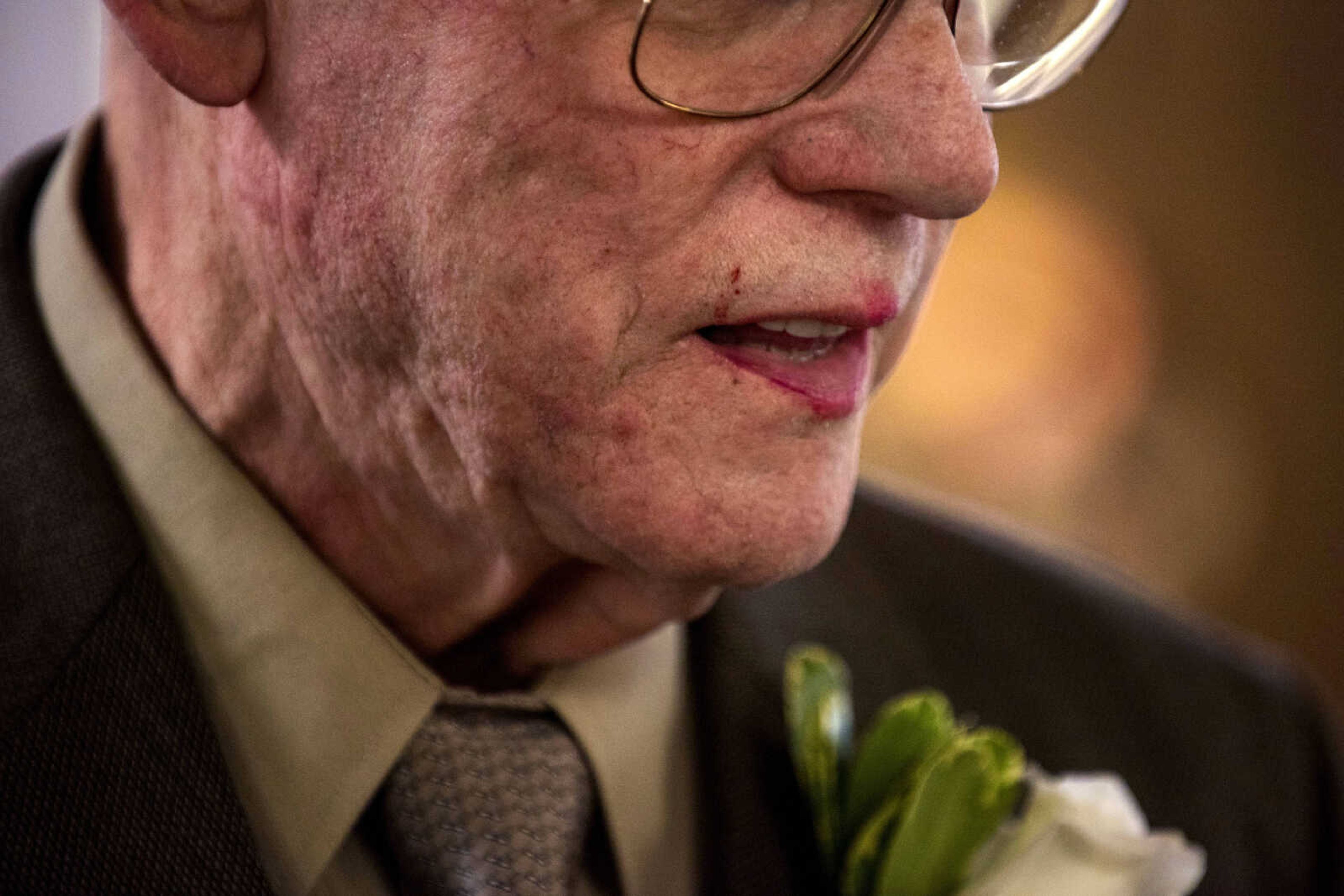 Lipstick is seen on 81-year-old Jim Mullins's lips after he and 82-year-old Eva Wilson shared their first kiss as husband and wife during a wedding ceremony at the Lutheran Home in Cape Girardeau Saturday, Nov. 10, 2018.
The pair met at the Lutheran Home in 2017.
"I came here assuming I was just going to come here to die," Mullins told the Southeast Missourian. "That's the way I felt. I was sitting in the corner, kind of staring at the floor, and Eva came over and started talking to me."