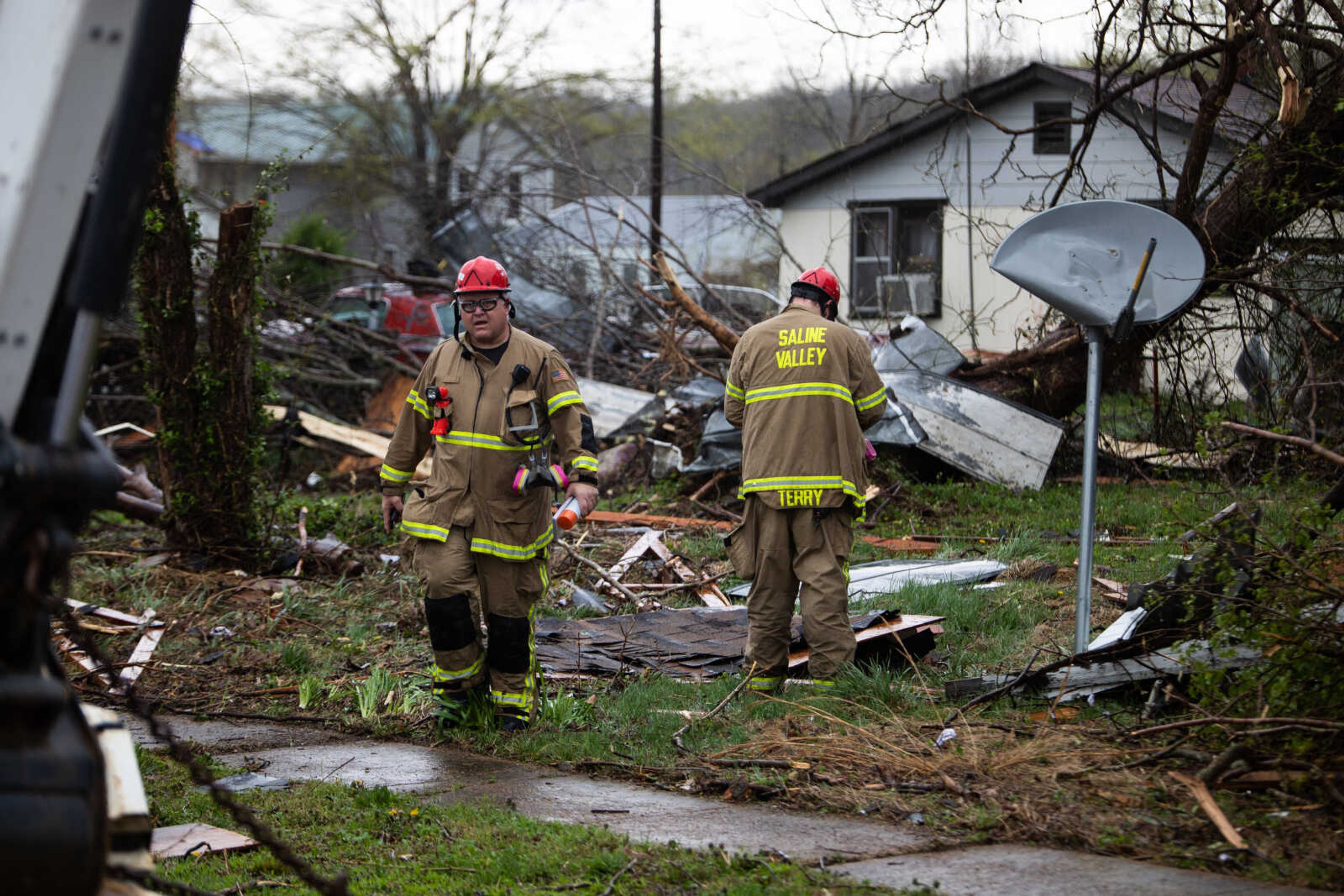 Firefighters survey the damage in Glen Allen.