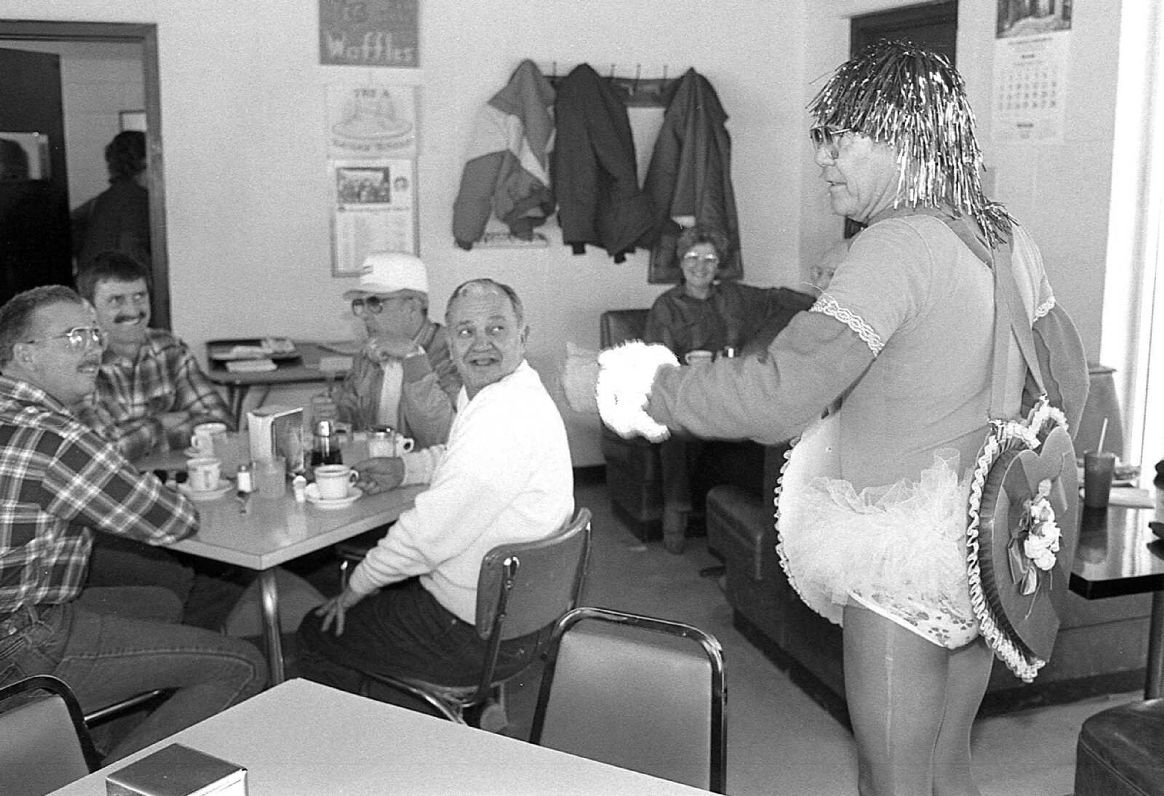 Published Feb. 16, 1987.
Patrons at Wimpy's restaurant in Cape Girardeau were surprised at a timely but unscheduled appearance by Cupid on Valentine's Day. John Hill also made stops at Esicar's, Sand's Pancake House and the Fashion Rental Boutique, where he cut a ribbon marking the recent opening of the new store. Hill worked as a local electrician for many years. (Fred Lynch ~ Southeast Missourian archive)