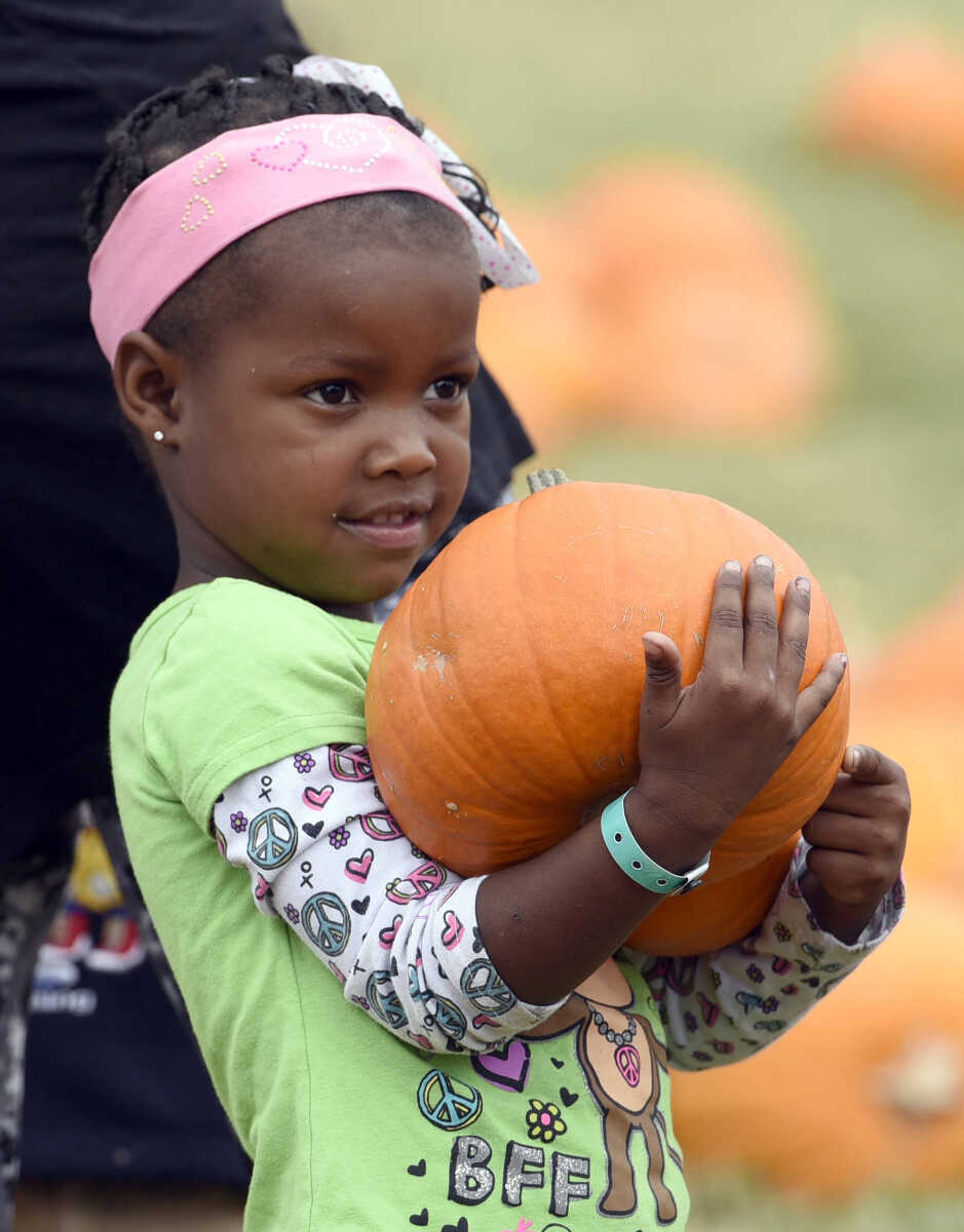 LAURA SIMON ~ lsimon@semissourian.com

Dashlay Gilbert picks out a pumpkin at the Grace United Methodist Church pumpkin patch on Wednesday, Oct. 12, 2016 in Cape Girardeau.