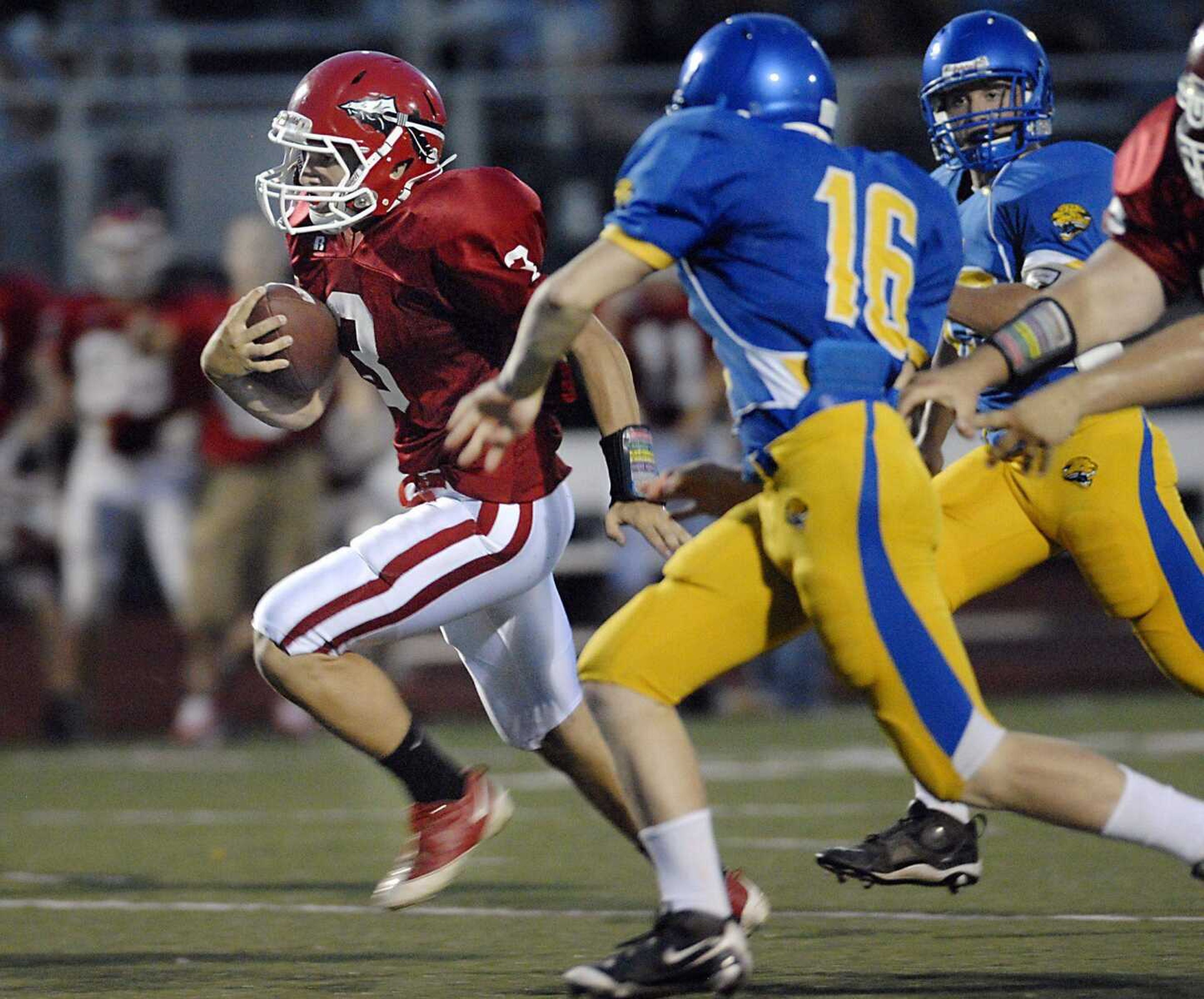 Jackson senior running back Ethan Ruch outruns Seckman defenders during Friday's jamboree in Farmington, Mo.