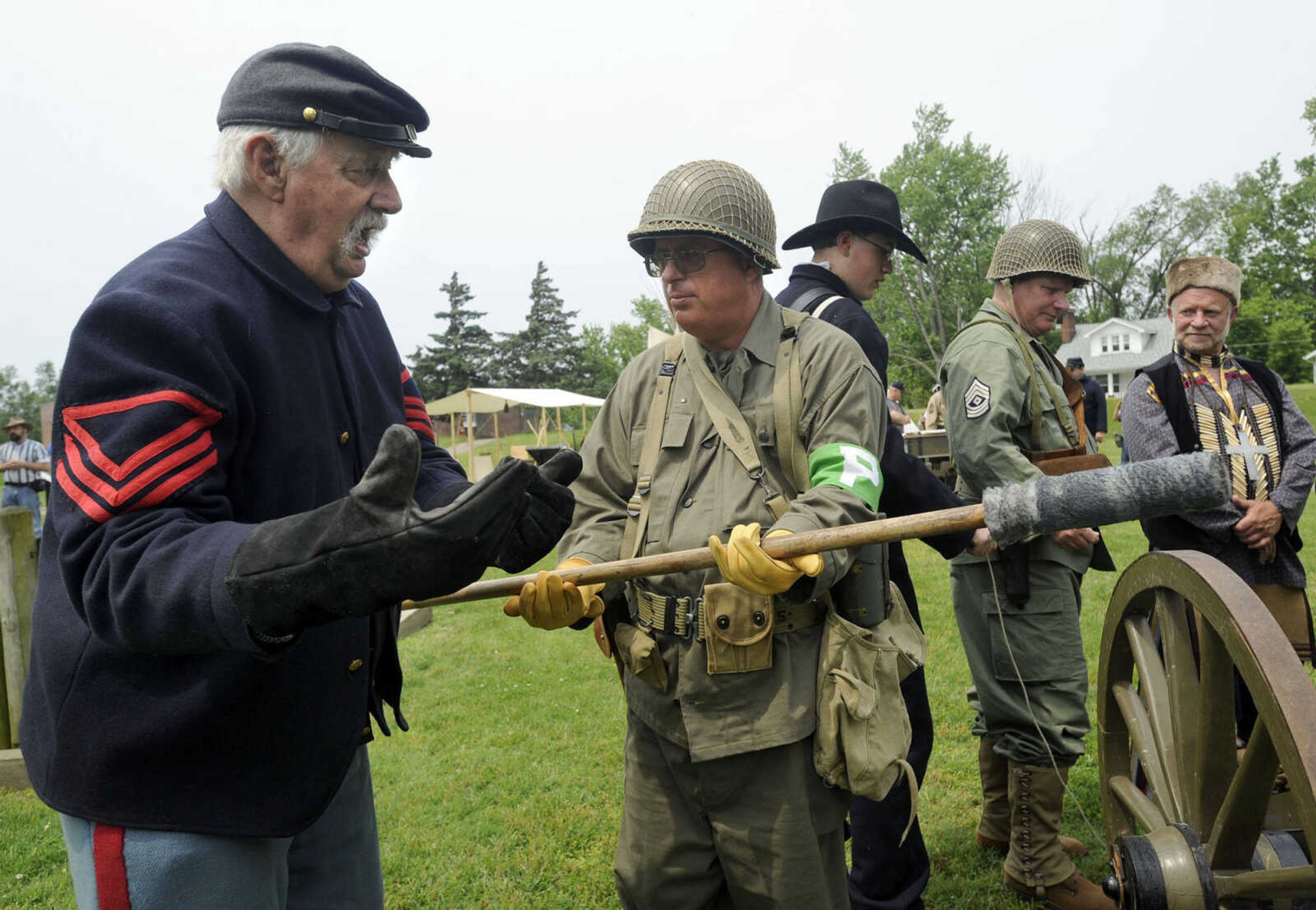 FRED LYNCH ~ flynch@semissourian.com
David Hagler, left, with the Turner Brigade instructs Stephen Golden with the SEMO Military Vehicles Group during a cannon drill Saturday, May 28, 2011 at Fort D historic site in Cape Girardeau.