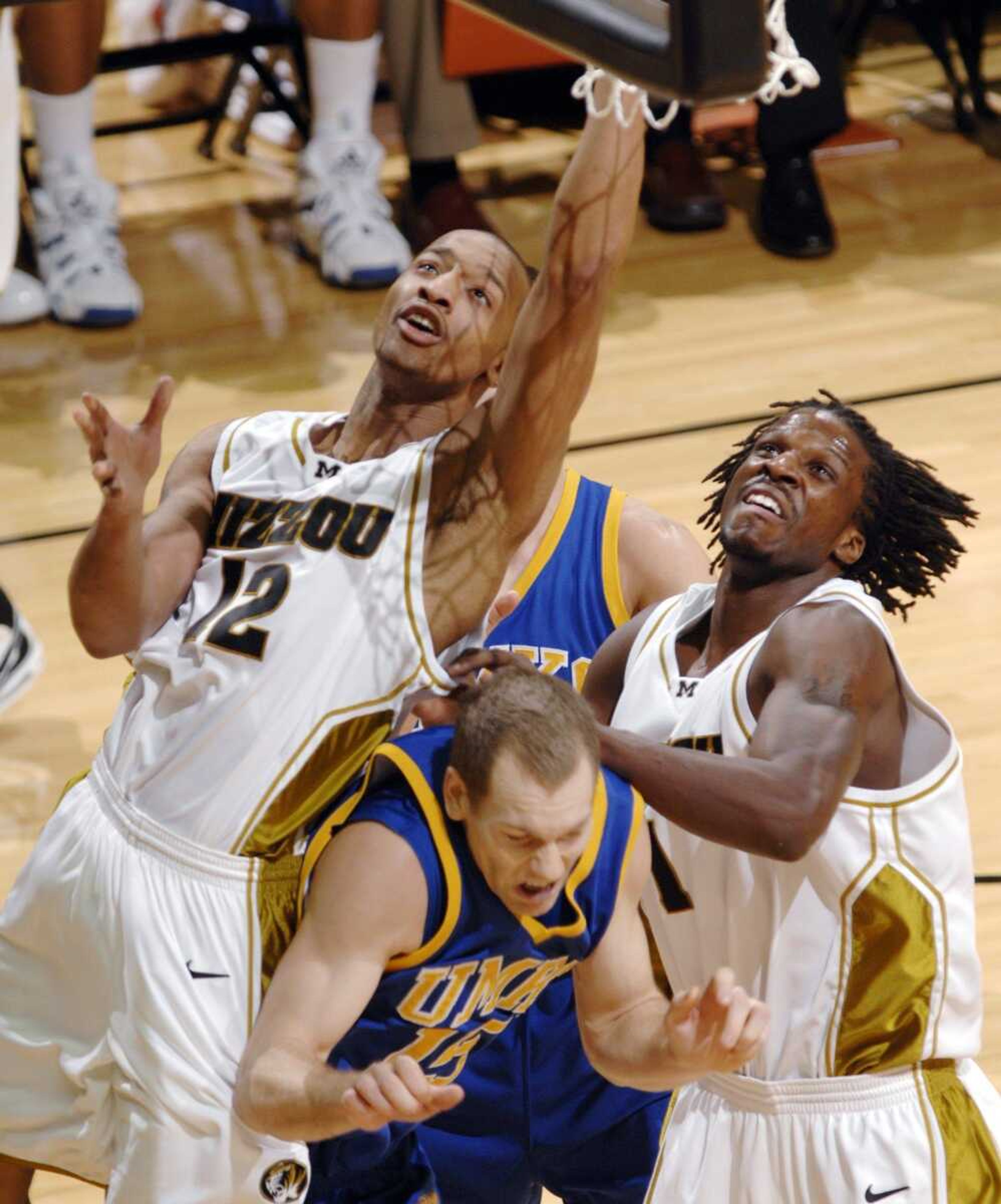 UMKC's Brent Stephens was sandwiched between Missouri's DeMarre Carroll, right, and Jason Horton as Horton shot during the first half Tuesday in Columbia, Mo. (L.G. PATTERSON ~ Associated Press)