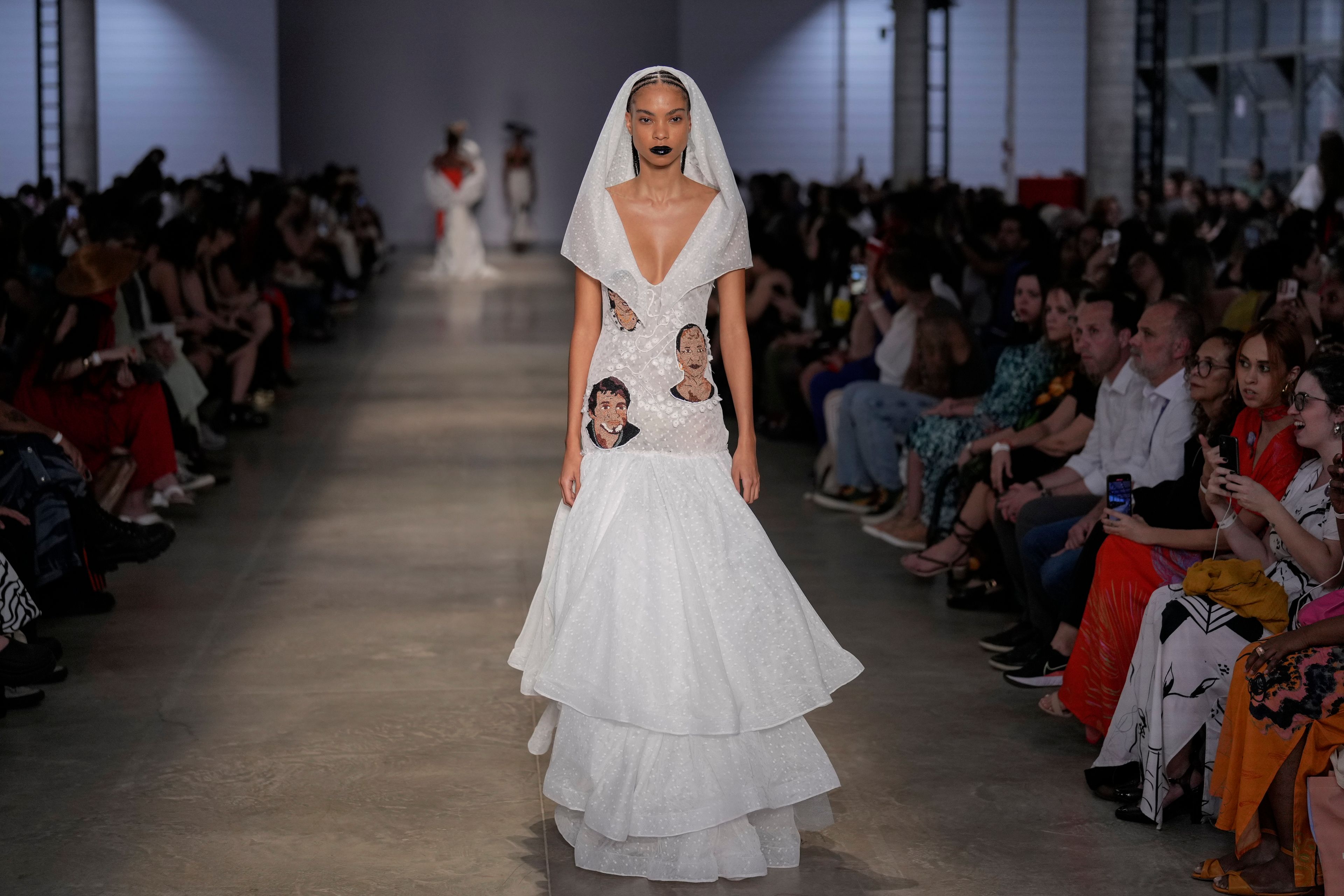 A model wears a creation from the Cria Costura collection during Sao Paulo Fashion Week in Sao Paulo, Thursday, Oct. 17, 2024. (AP Photo/Andre Penner)