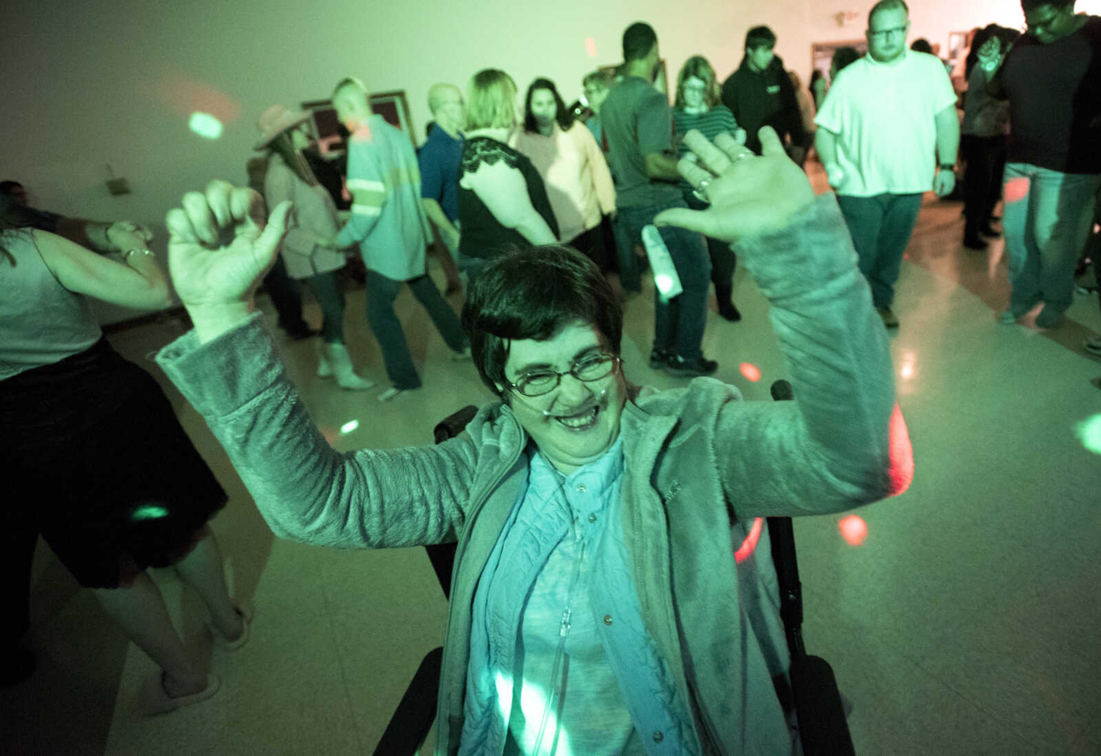 People dance during the S.T.A.R. Barnyard Dance in the 4-H Building at Arena Park Thursday, Nov. 16, 2017 in Cape Girardeau.