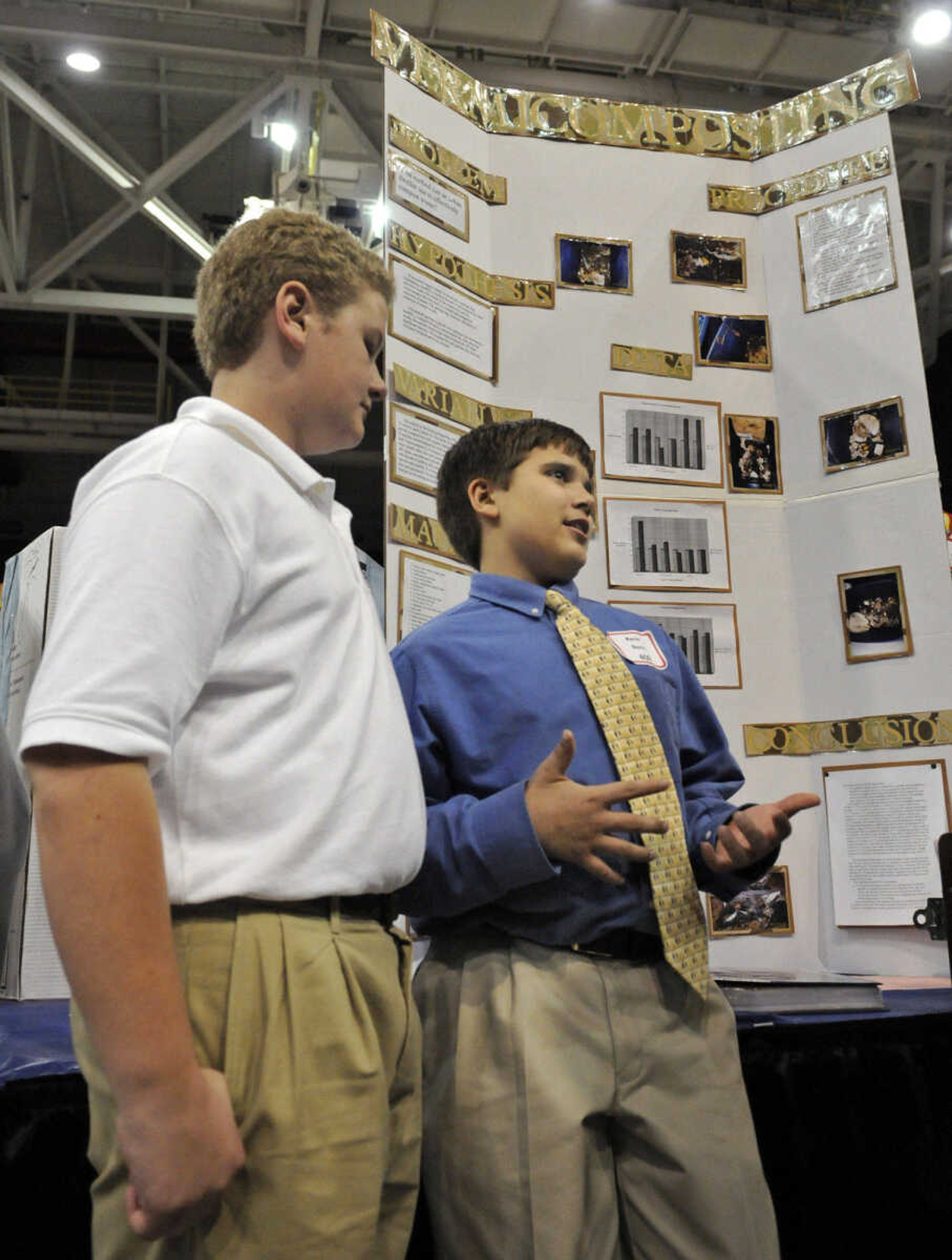 KRISTIN EBERTS ~ keberts@semissourian.com

Farmington seventh-graders John Pinkerton II, 13, left, and Kevin Davis, 12, right, talk with judges about their project on reducing waste in landfills during the 54th Annual Southeast Missouri Regional Science Fair at the Show Me Center on Tuesday, March 9, 2010.