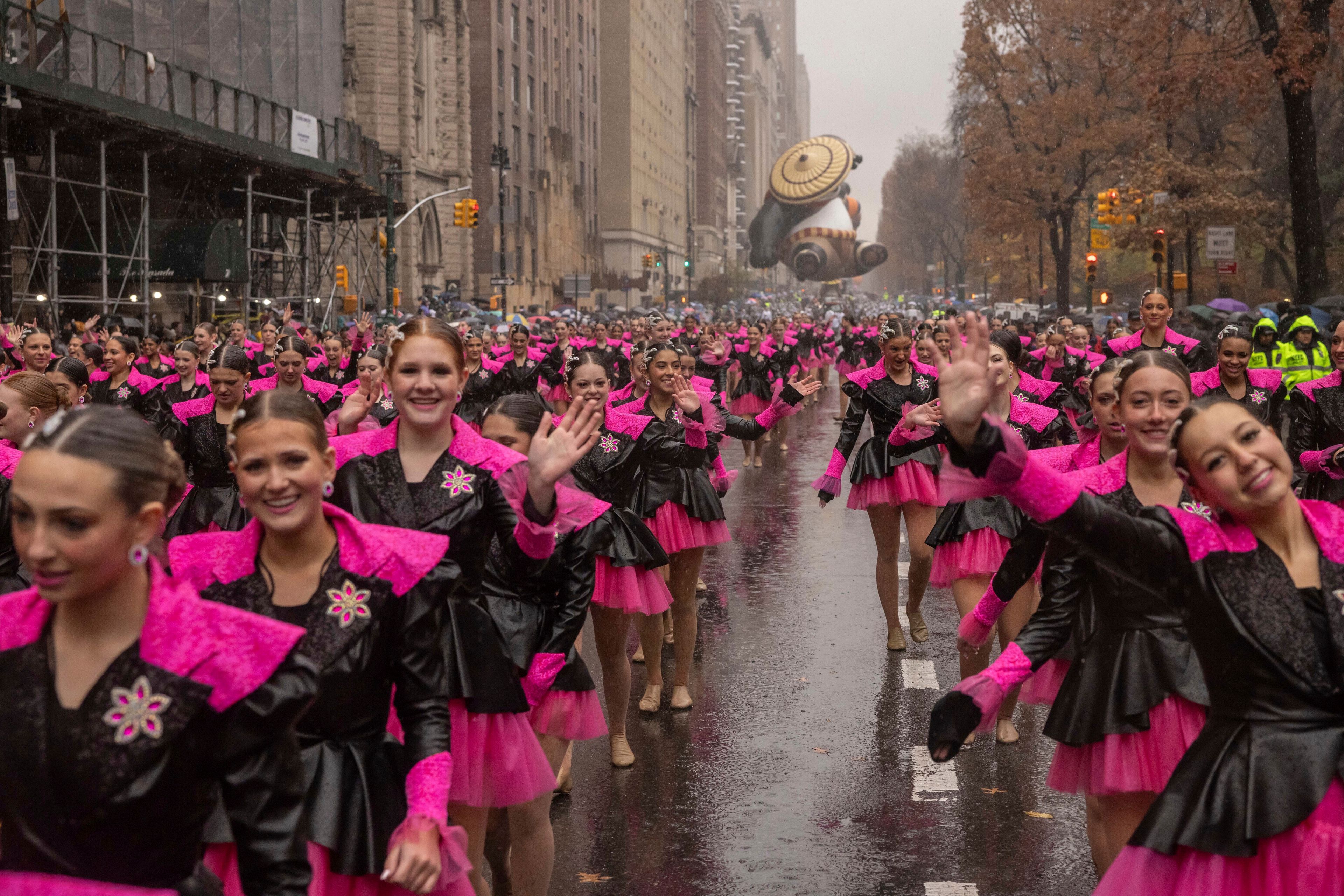 Parade performers march down Central Park West during the Macy's Thanksgiving Day parade, Thursday, Nov. 28 2024, in New York. (AP Photo/Yuki Iwamura)