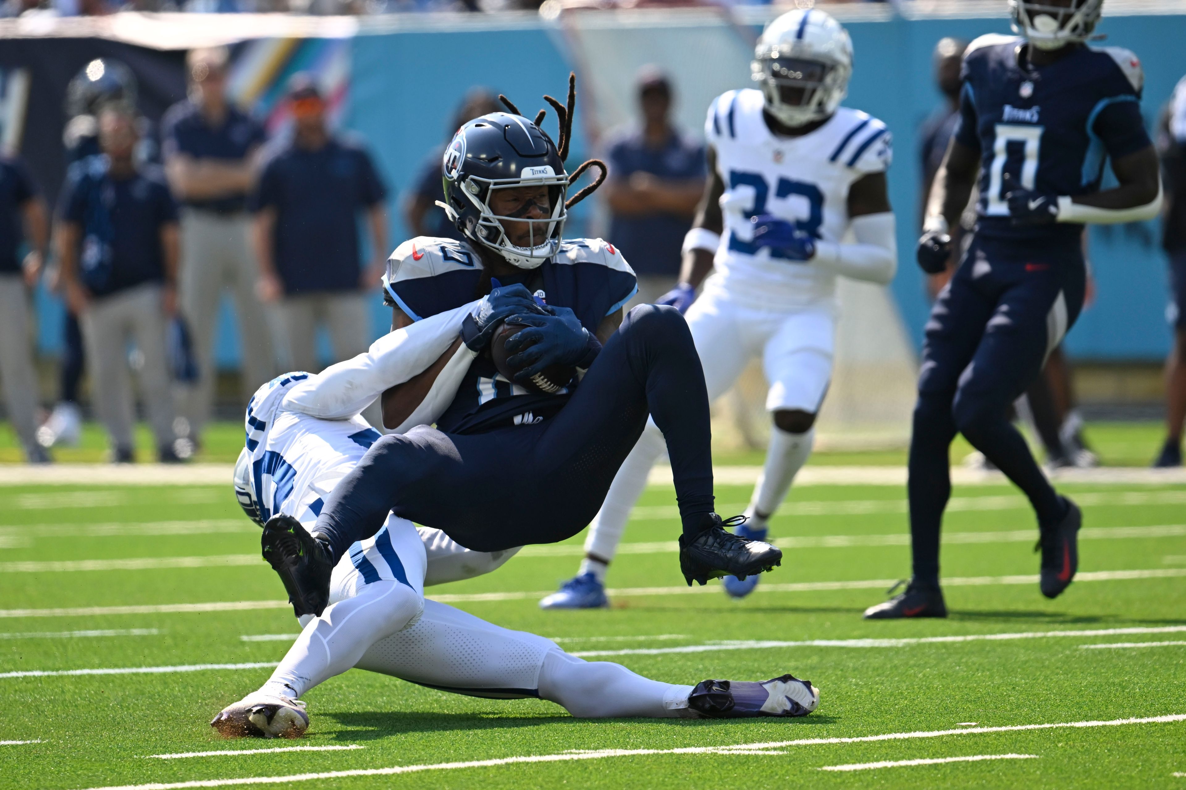 Tennessee Titans' DeAndre Hopkins (10) makes a catch against Indianapolis Colts' Jaylon Jones (40) during the first half of an NFL football game, Sunday, Oct. 13, 2024, in Nashville, Tenn. (AP Photo/John Amis)