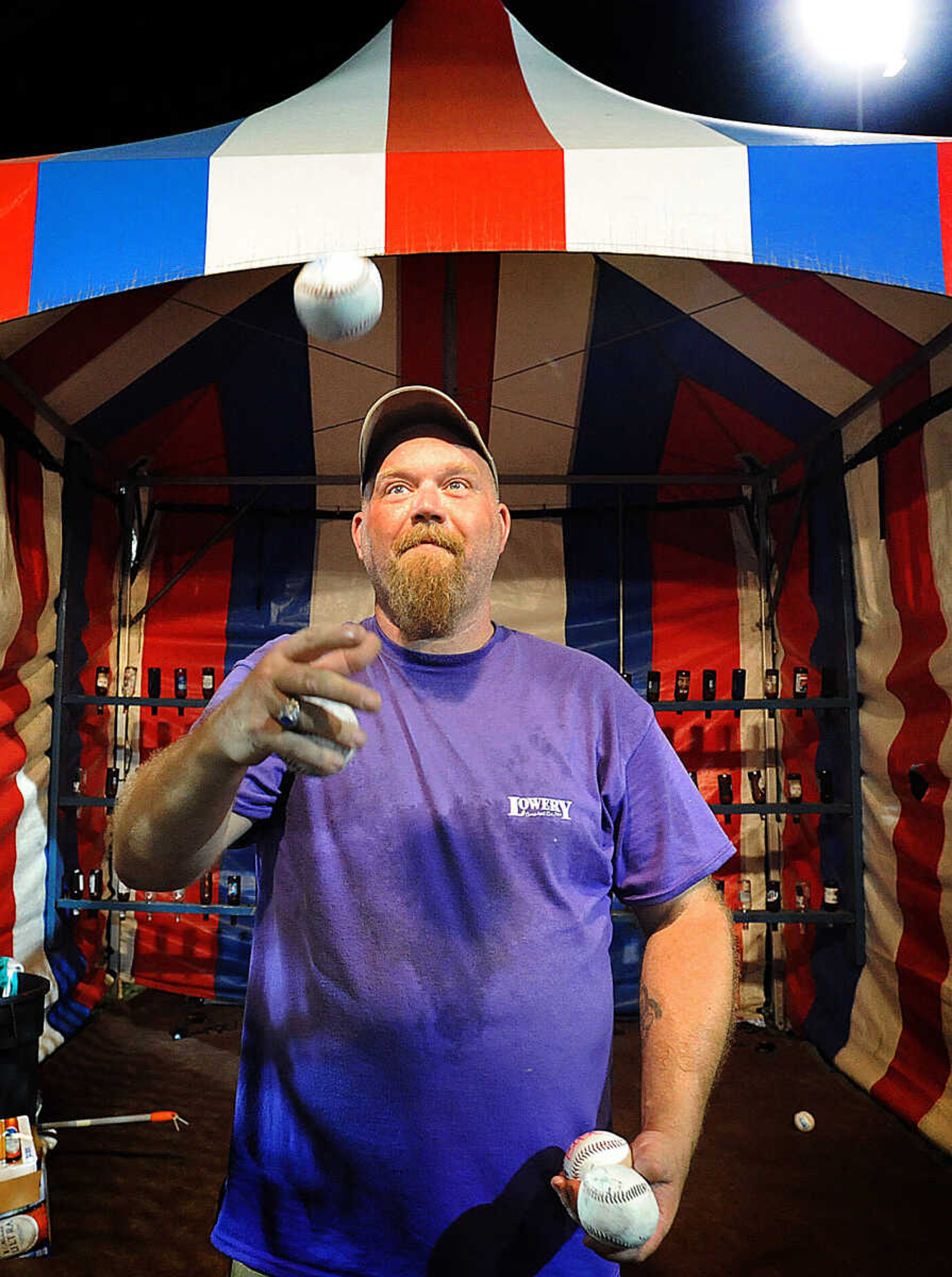 LAURA SIMON ~ lsimon@semissourian.com

Charles Harless works the Beer Bust game at the SEMO District Fair, Wednesday, Sept. 10, 2014.